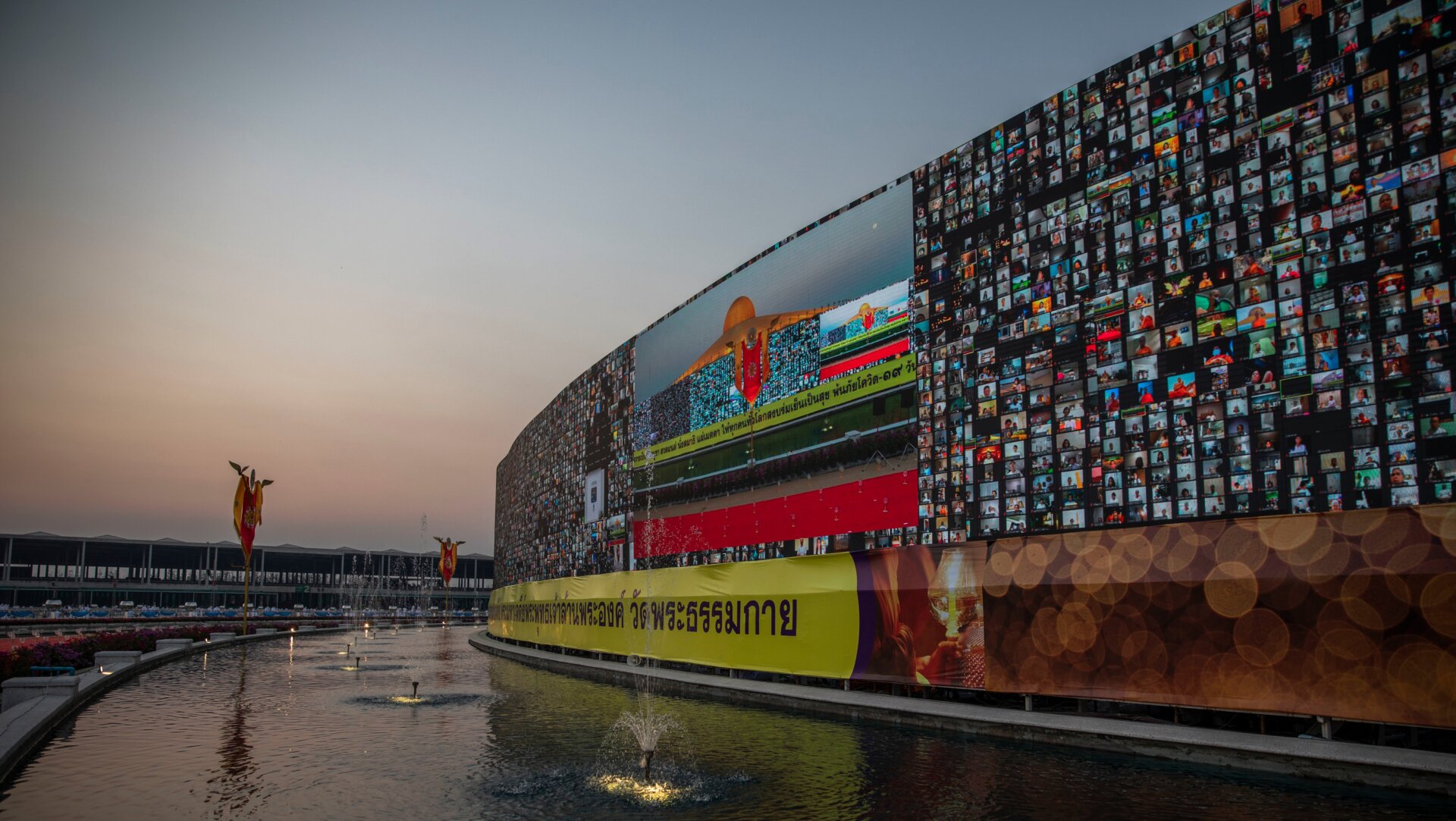 A 280-meter-long screen shows virtual devotees participating in an online candle lighting ceremony at Wat Phra Dhammakaya on February 26, 2021 in Bangkok, Thailand. 