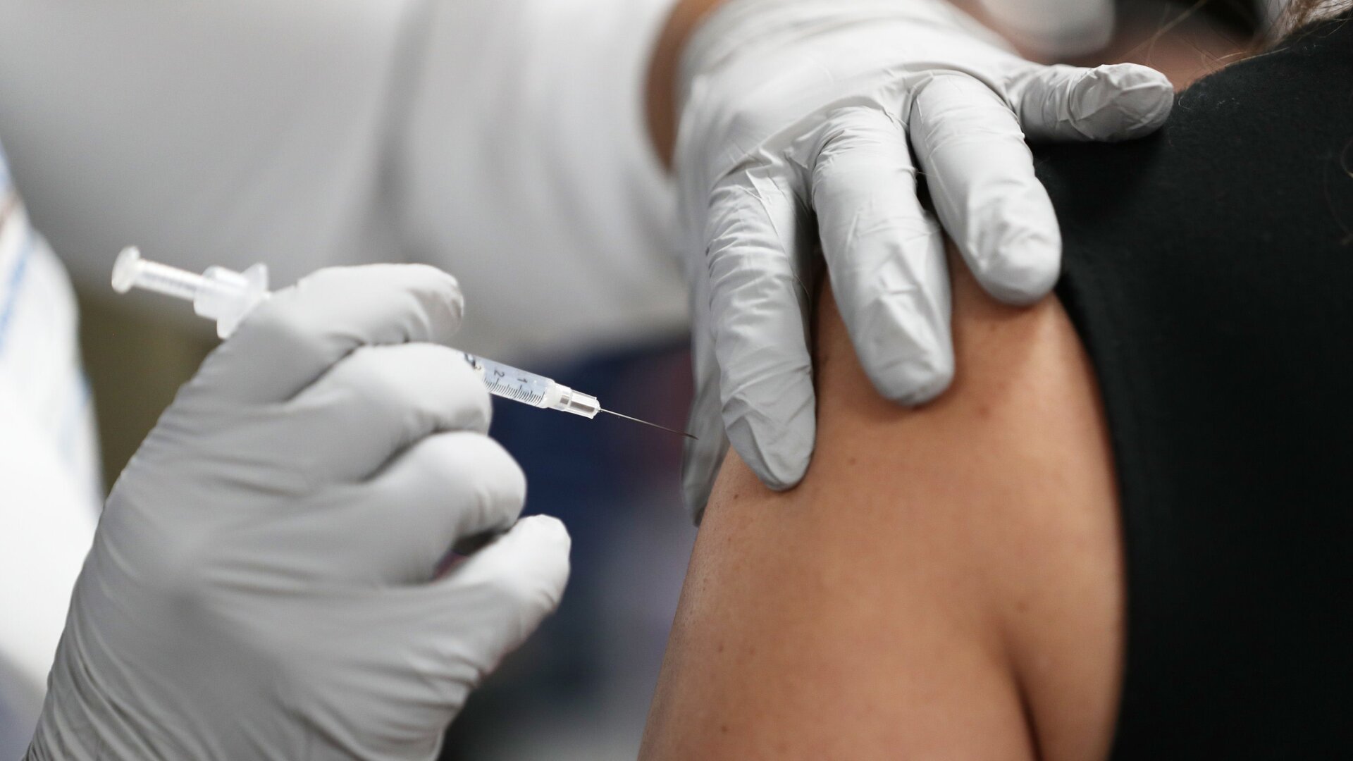 A health care worker receiving the Pfizer-BioNtech covid-19 vaccine at the Jackson Memorial Hospital on December 15, 2020, in Miami, Florida.