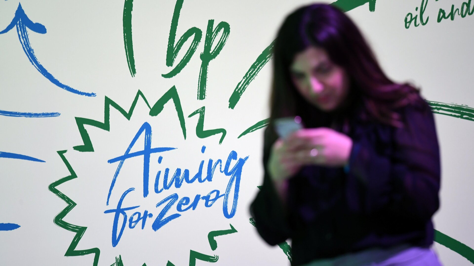 An attendee at a London event last February, where BP CEO Bernard Looney (unseen) declared the company’s intentions to achieve “net zero” carbon emissions by 2050.