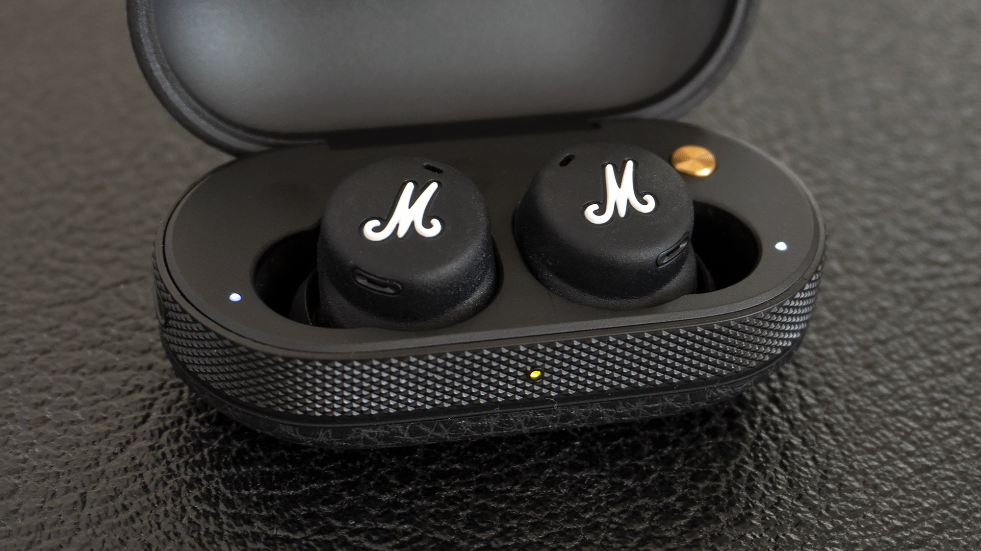 Three status LEDs let you know when the buds are charging, when they’re in Bluetooth pairing mode, and how much charge the case has left. (The LED on the front changes from red, to orange, to green.)