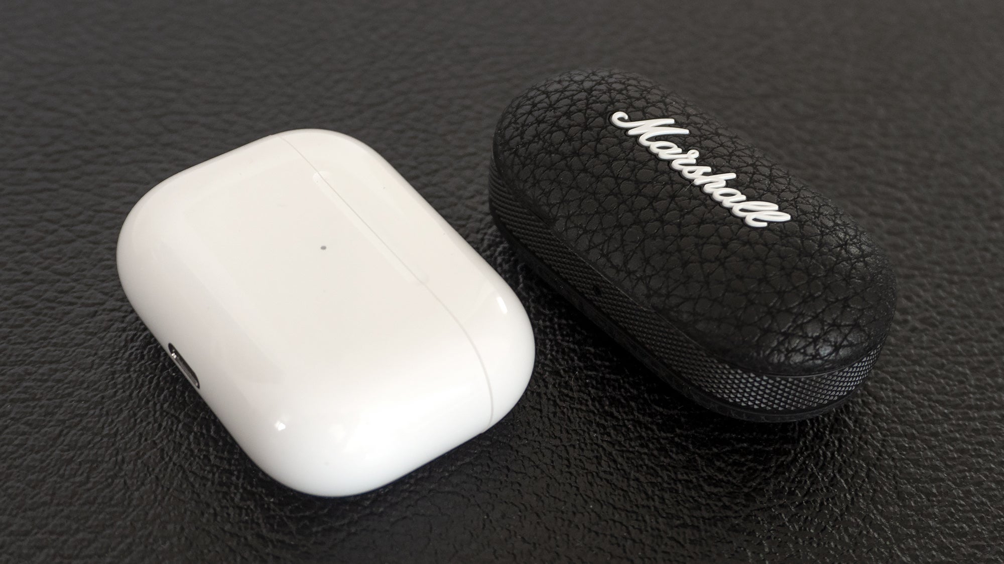 It’s a toss-up between the AirPods Pro (left) and the Marshall Mode II (right) as to which set of wireless earbuds has the smaller charging case.