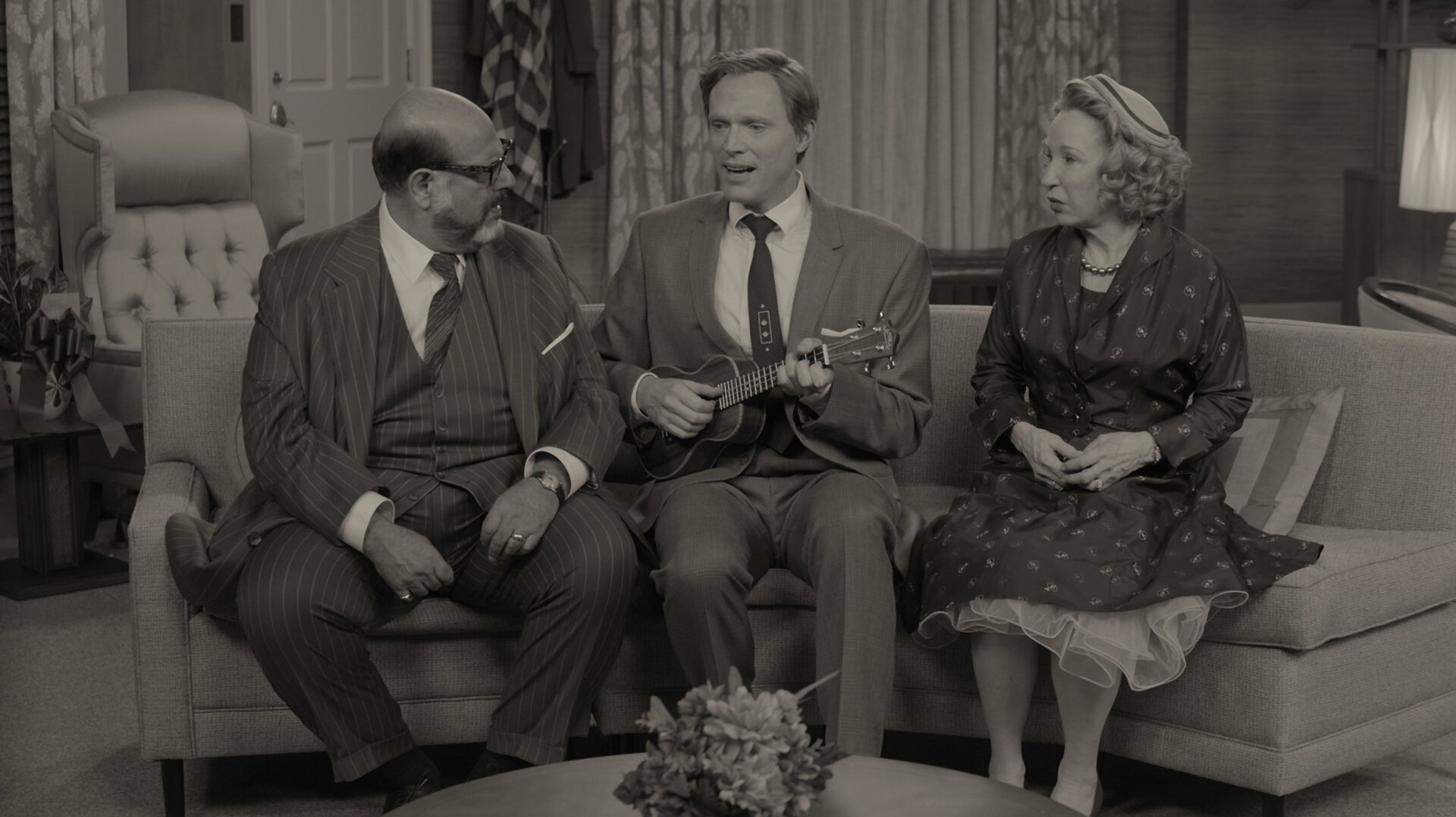 Fred Melamed and Debra Jo Rupp are the bread in a Paul Bettany sandwich.