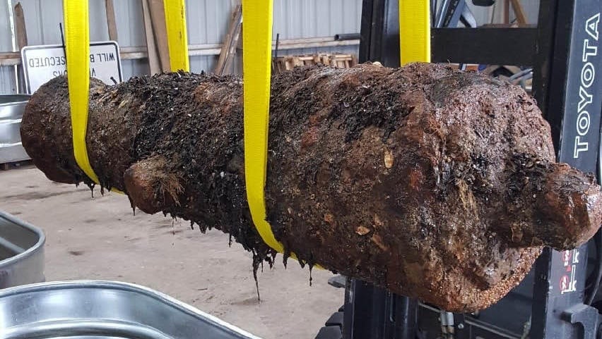The guns are being kept in tubs of water for preservation purposes.
