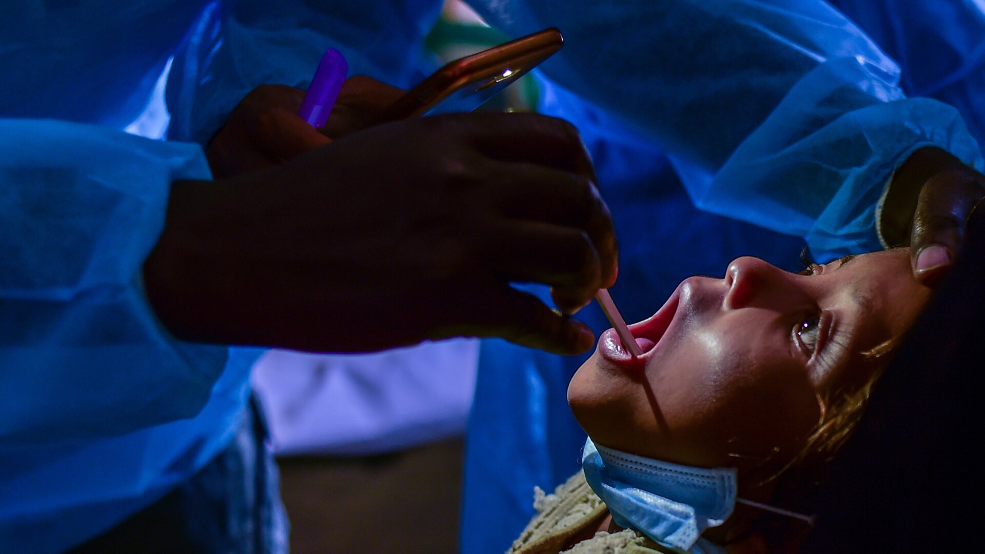 A doctor treating a child with diphtheria in the Bangladeshi town of Thankhali in 2018. Though still rare, cases of the vaccine-preventable disease have climbed in recent years.