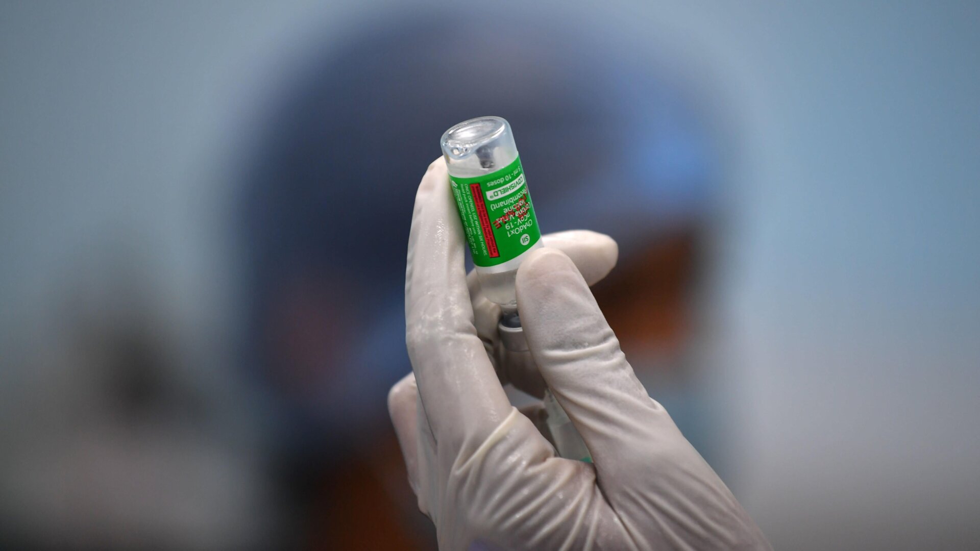 A staff member of the Rajawadi Hospital in India holds a vial of Covishield, AstraZeneca’s Covid-19 coronavirus vaccine made by India’s Serum Institute.