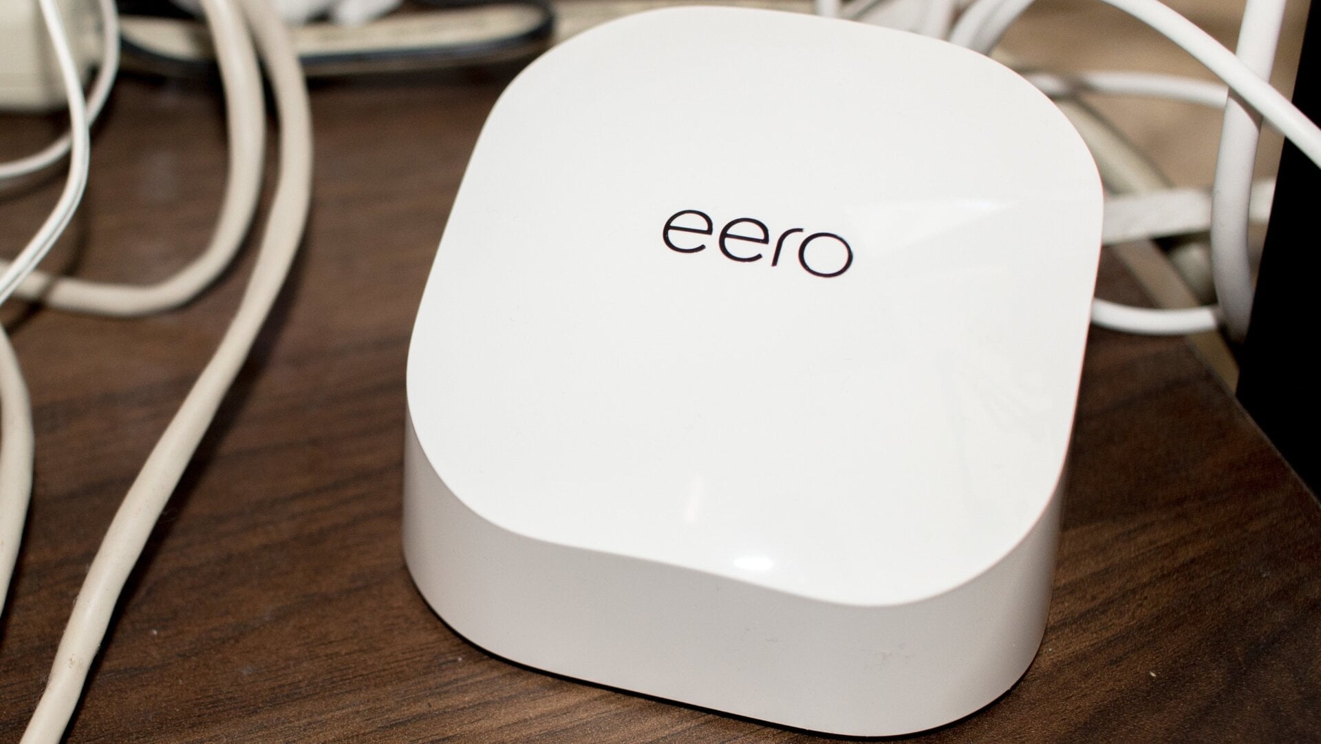 Truly, this is what the Eero 6 looks like: a rectangular puck amongst a mess of cables. 