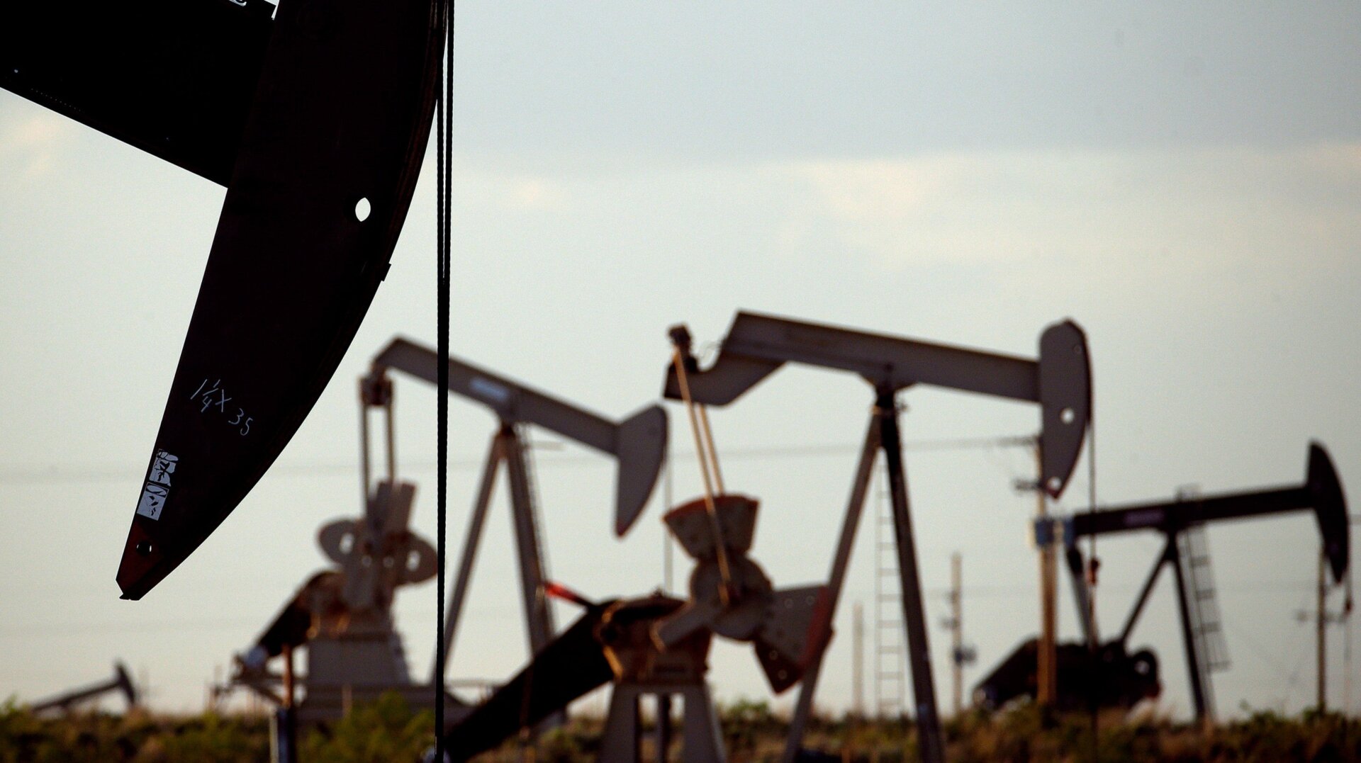 Pumpjacks work in a field near Lovington, N.M.