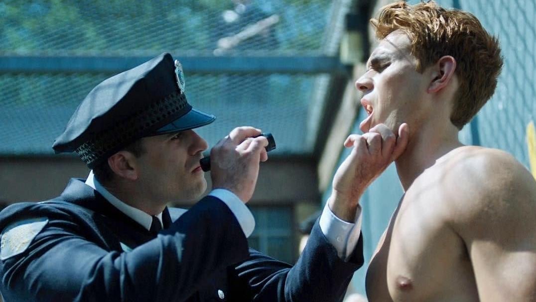 Archie being inspected at a prison for delinquent teens.