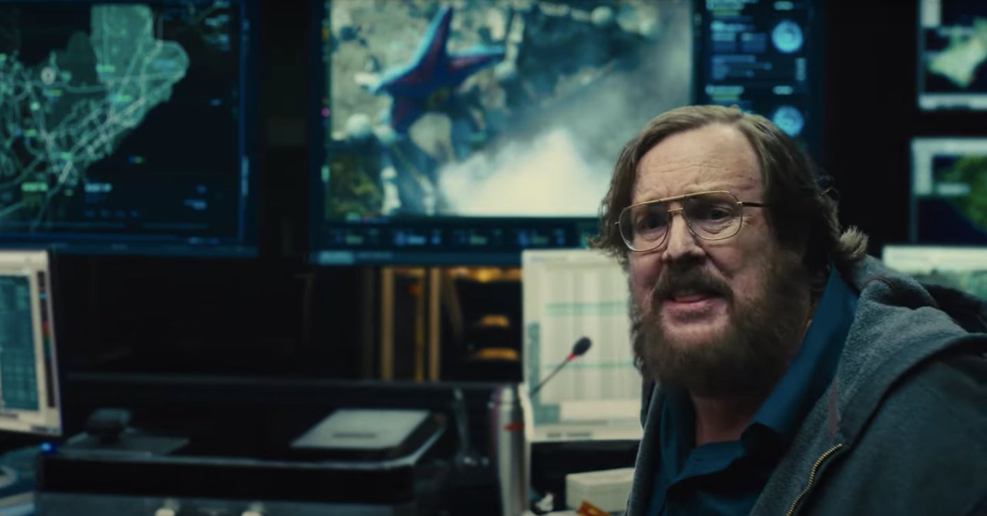 Starro saying hello to the world as Belle Reve’s warden looks on.