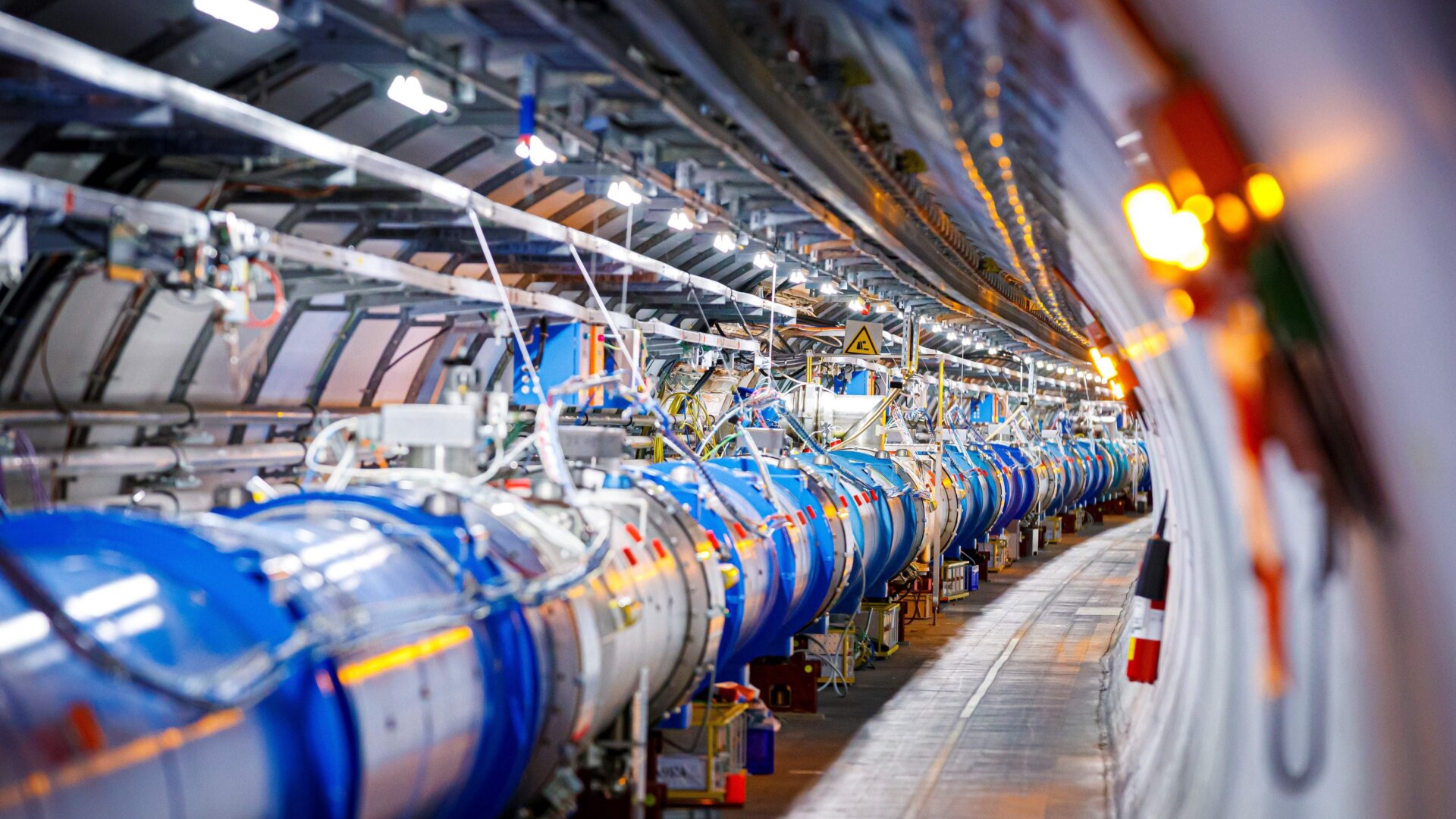 Some of the 1232 dipole magnets that bend the path of accelerated protons are pictured in the Large Hadron Collider (LHC) in a tunnel of the European Organization for Nuclear Research (CERN), during maintenance work.