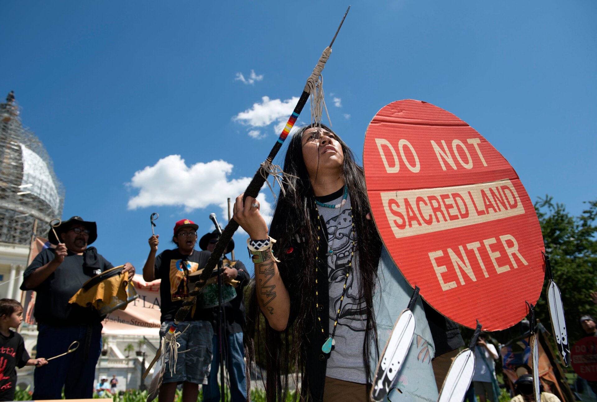 An Apache activist dancer performs in a rally to save the Oak Flat area, in front of the U.S. Capitol.