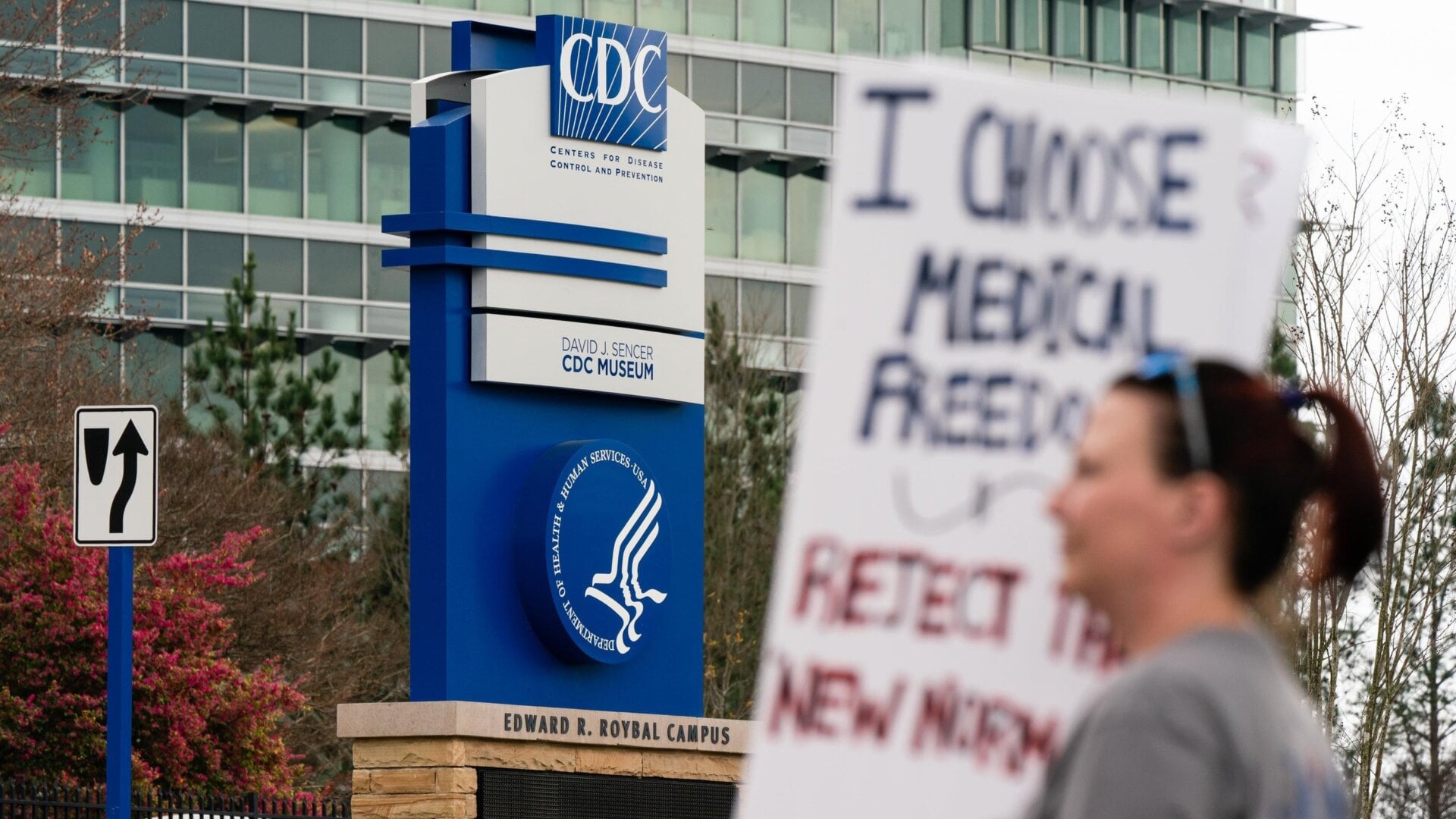 {Pro-coronavirus protesters outside the CDC headquarters in Atlanta, Georgia on March 13, 2021, when national statistics show 1,873 deaths from the virus.