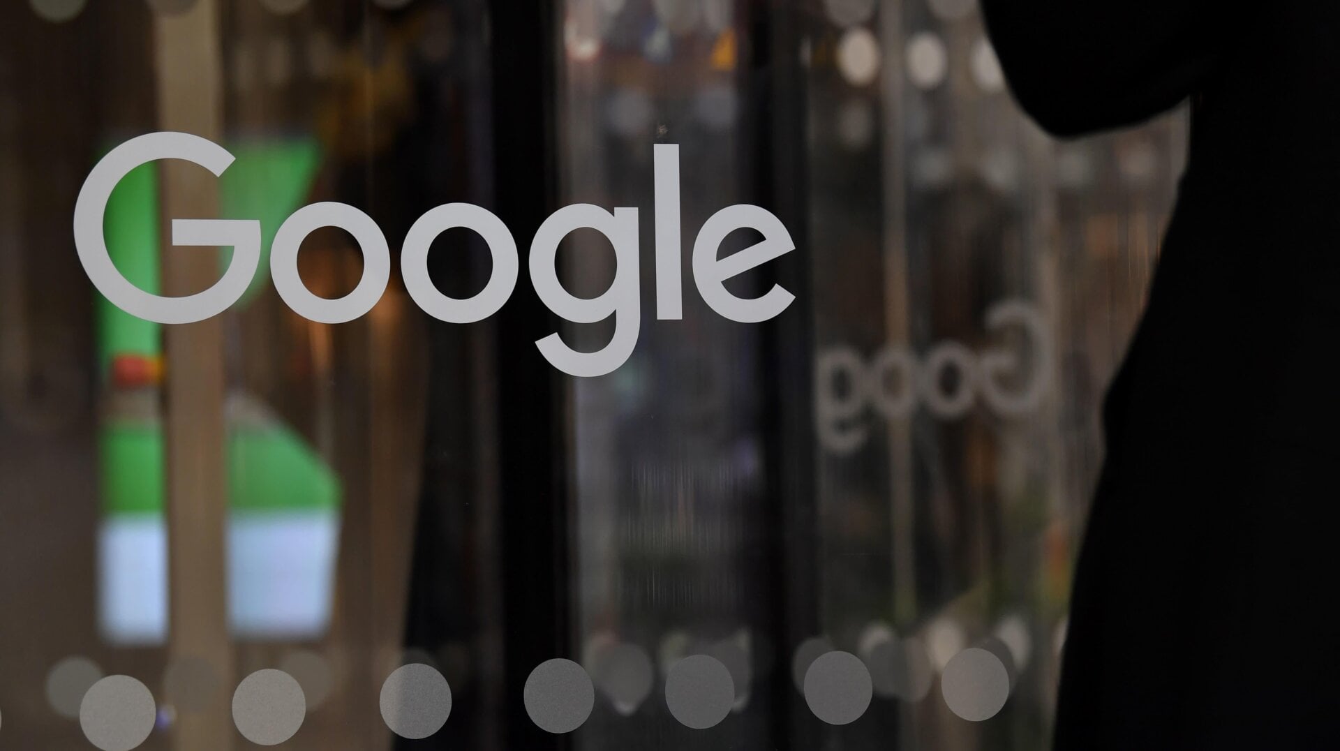 A visitor enters the the offices of Google in London.