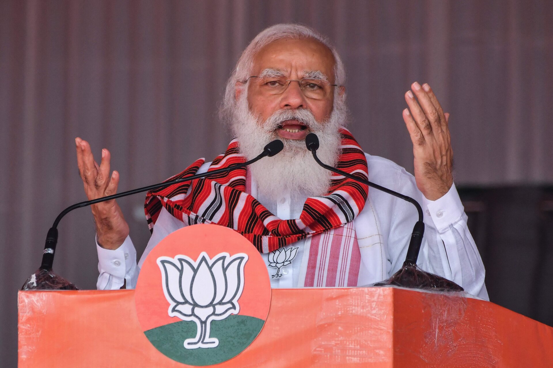 India’s Prime Minister Narendra Modi gestures as he addresses a public meeting ahead of Assam Assembly elections, in Bokakhat on March 21, 2021. 