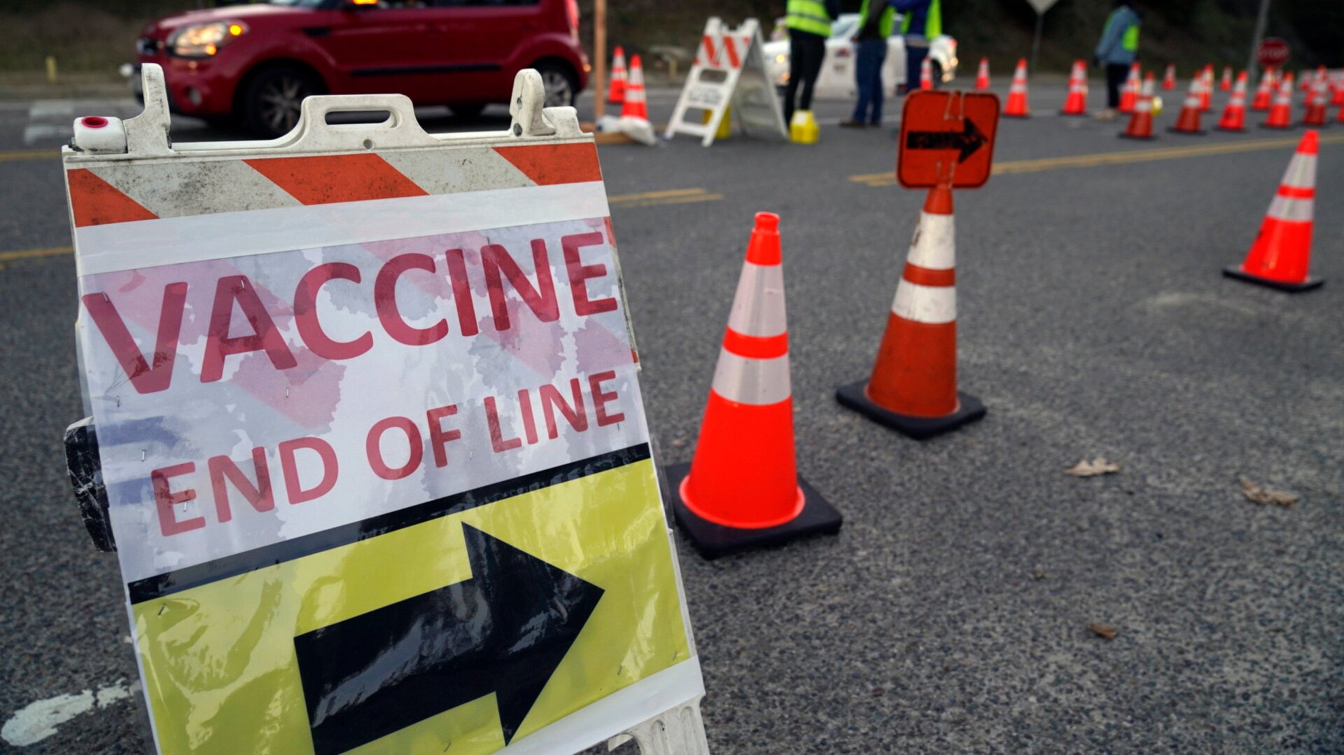 A sign directing people to a covid-19 vaccination clinic held at Dodgers Stadium in Los Angeles this past January.