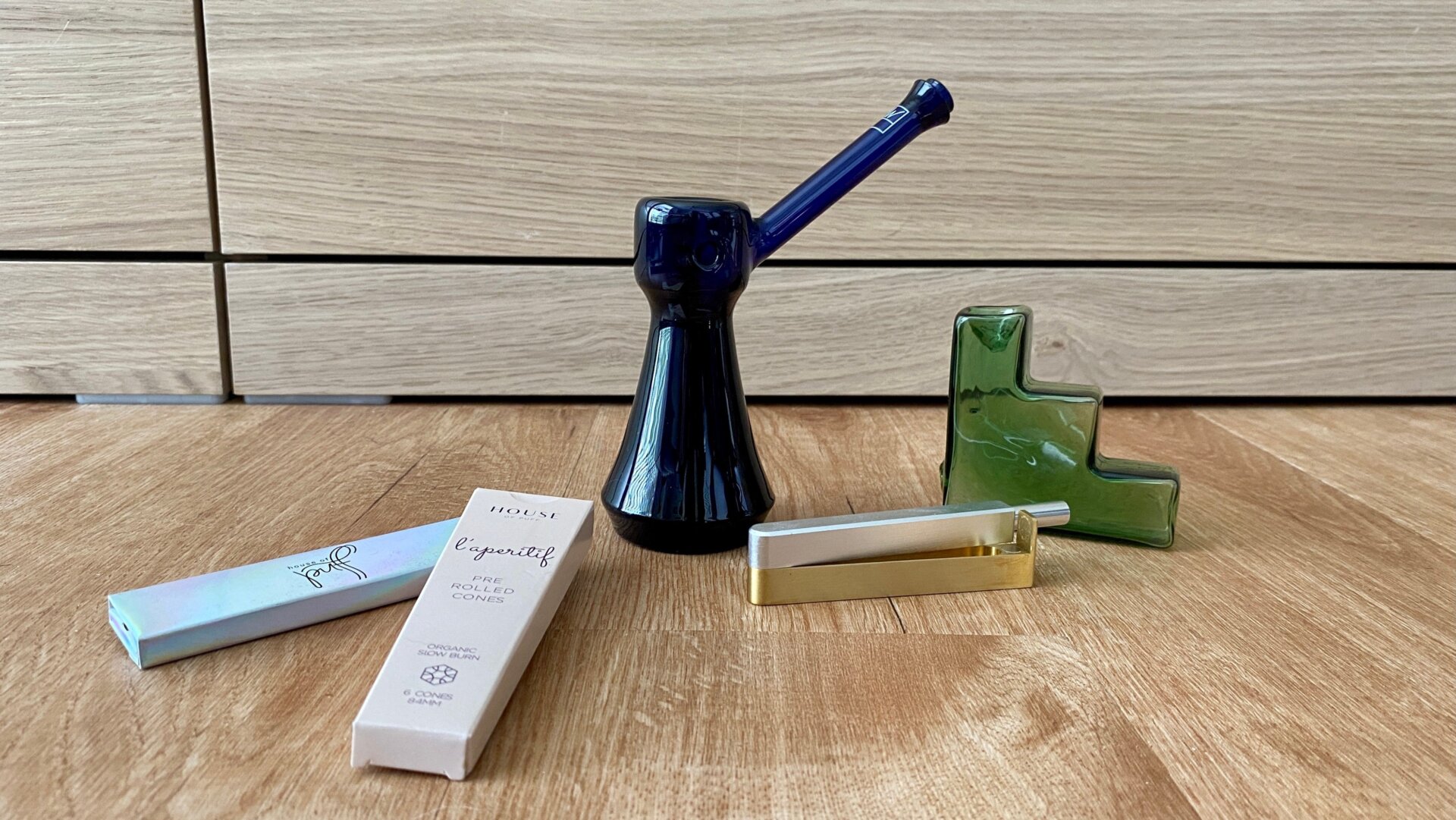 Rolling papers from House of Puff; Upright Bubbler from Jane West; Nomad Pipe from Tetra; Glass Tanjun Pipe by Laundry Day.