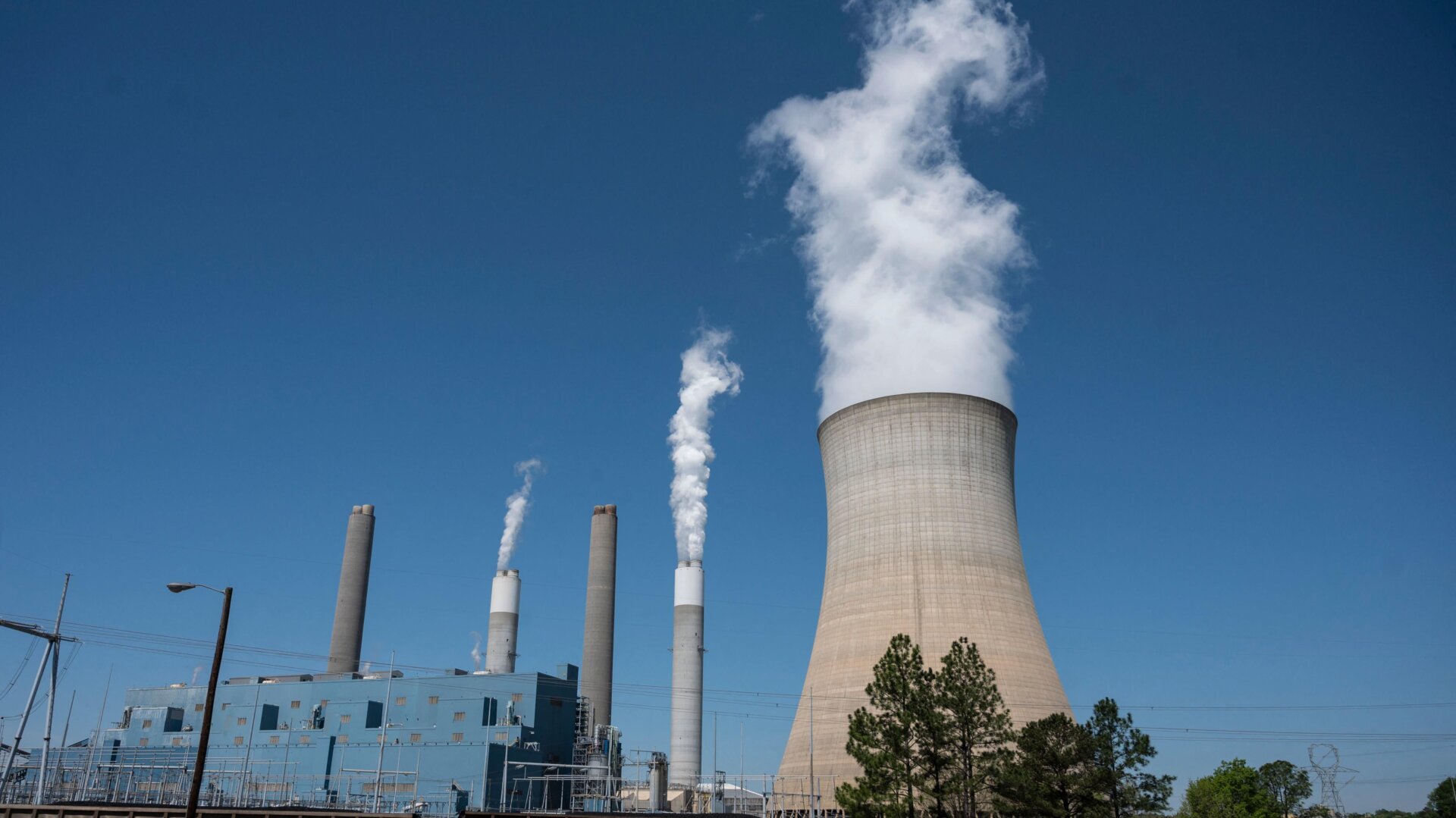 Steam rises from the Miller coal Power Plant in Adamsville, Alabama on April 13, 2021.