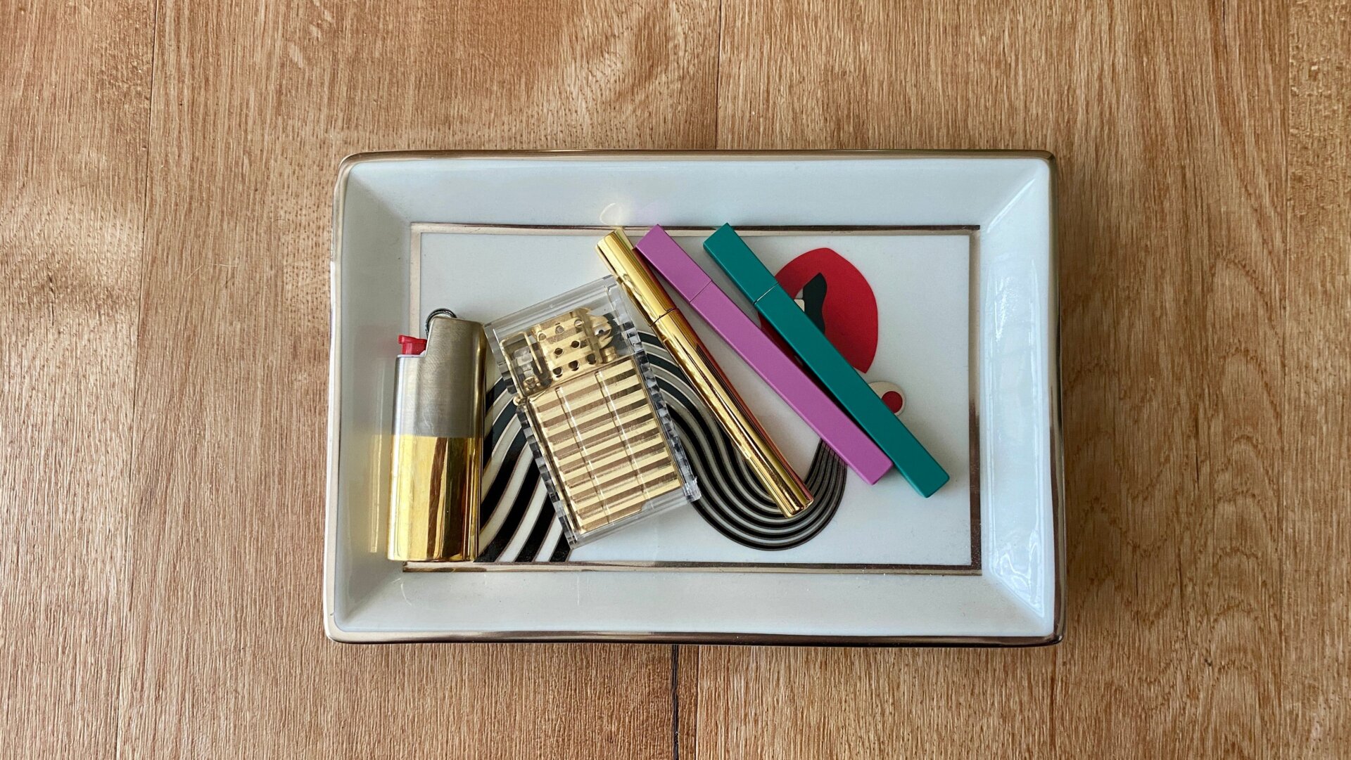 Jonathan Adler tray from Higher Standards; lighters by Tetra and Tsubota Pearl.