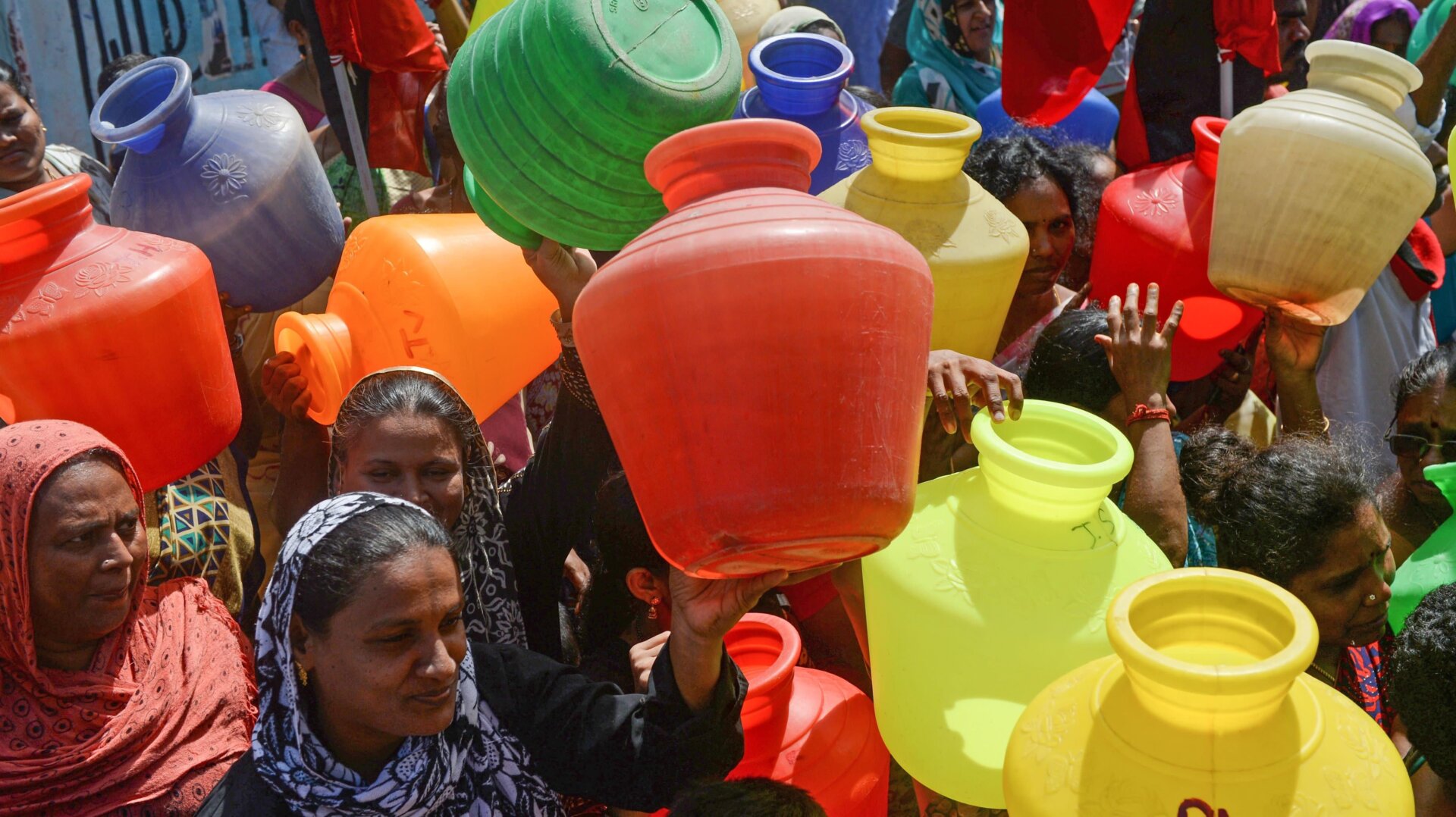 Indian women with empty plastic pots protest as they demand drinking water in Chennai on June 22, 2019.