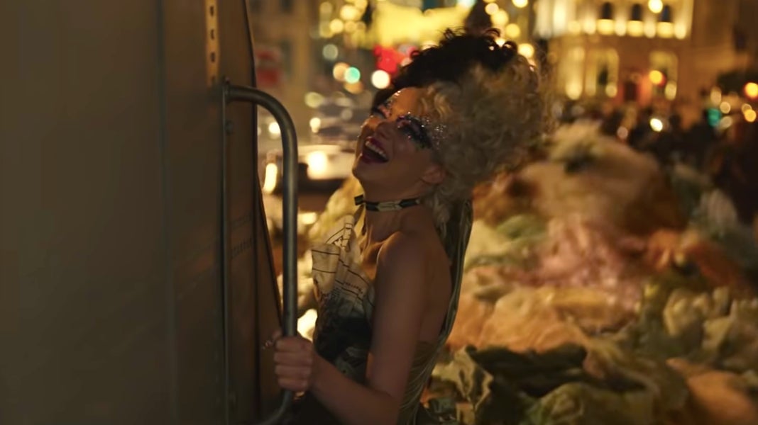 Cruella channeling her inner Health Ledger as the Joker.