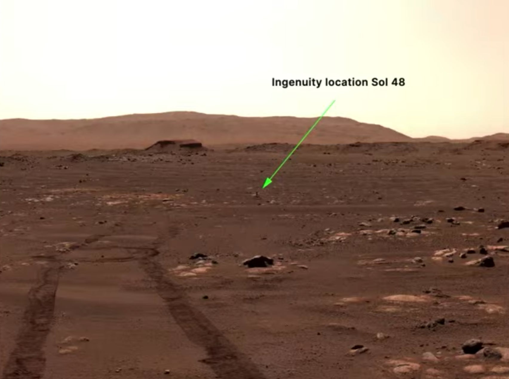 Ingenuity, all by its lonesome, standing in its “airfield.”