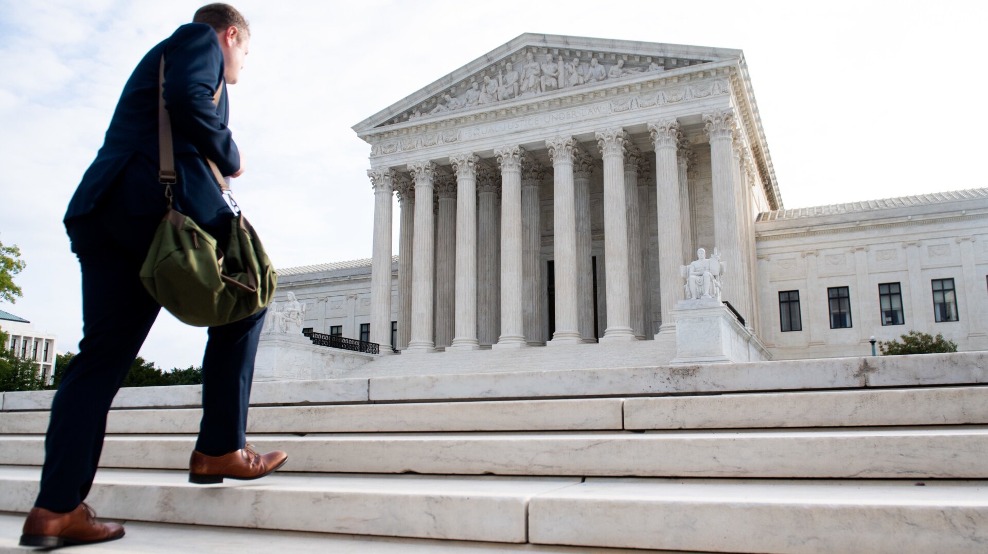 A man walks up the steps on the first day of a new term at the US Supreme Court in Washington, DC, October 7, 2019