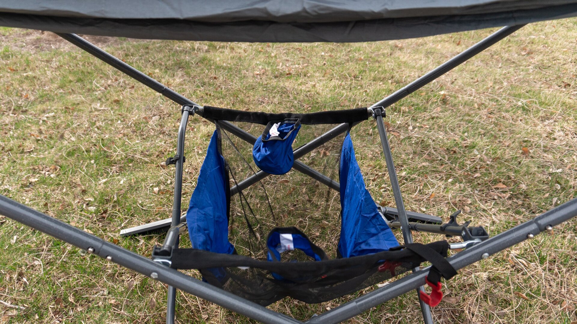 An under-hammock mesh storage basket includes a pair of fabric cup holders, but they’re not easy to reach while you’re stretched out on top.