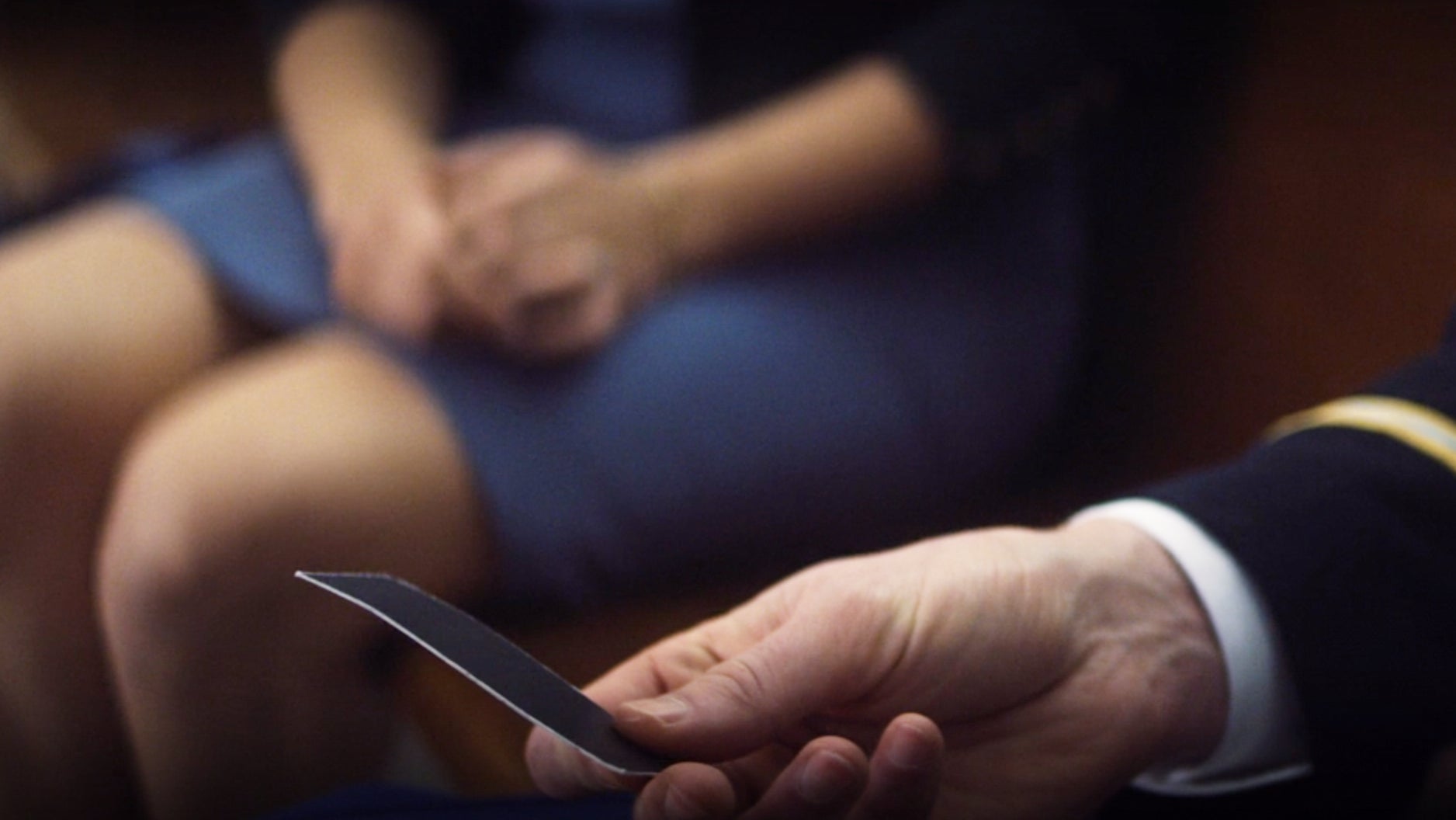 John Walker receives a mysterious card from an even more mysterious figure.