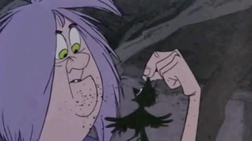 Madame Mim sizes up the strange creature (a transformed Arthur) that just appeared in her fireplace.