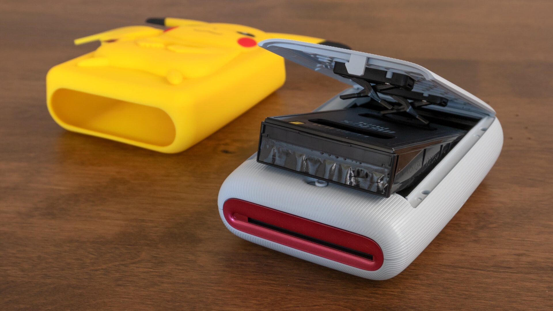 Setting up the printer is as easy as charging it, inserting a film cartridge, and then closing the lid.