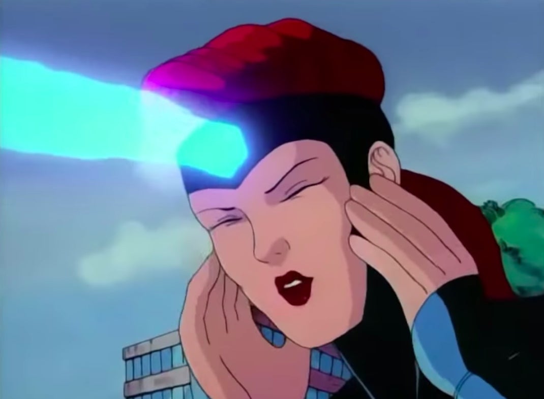 Jean struggling to held up a building with her mind.