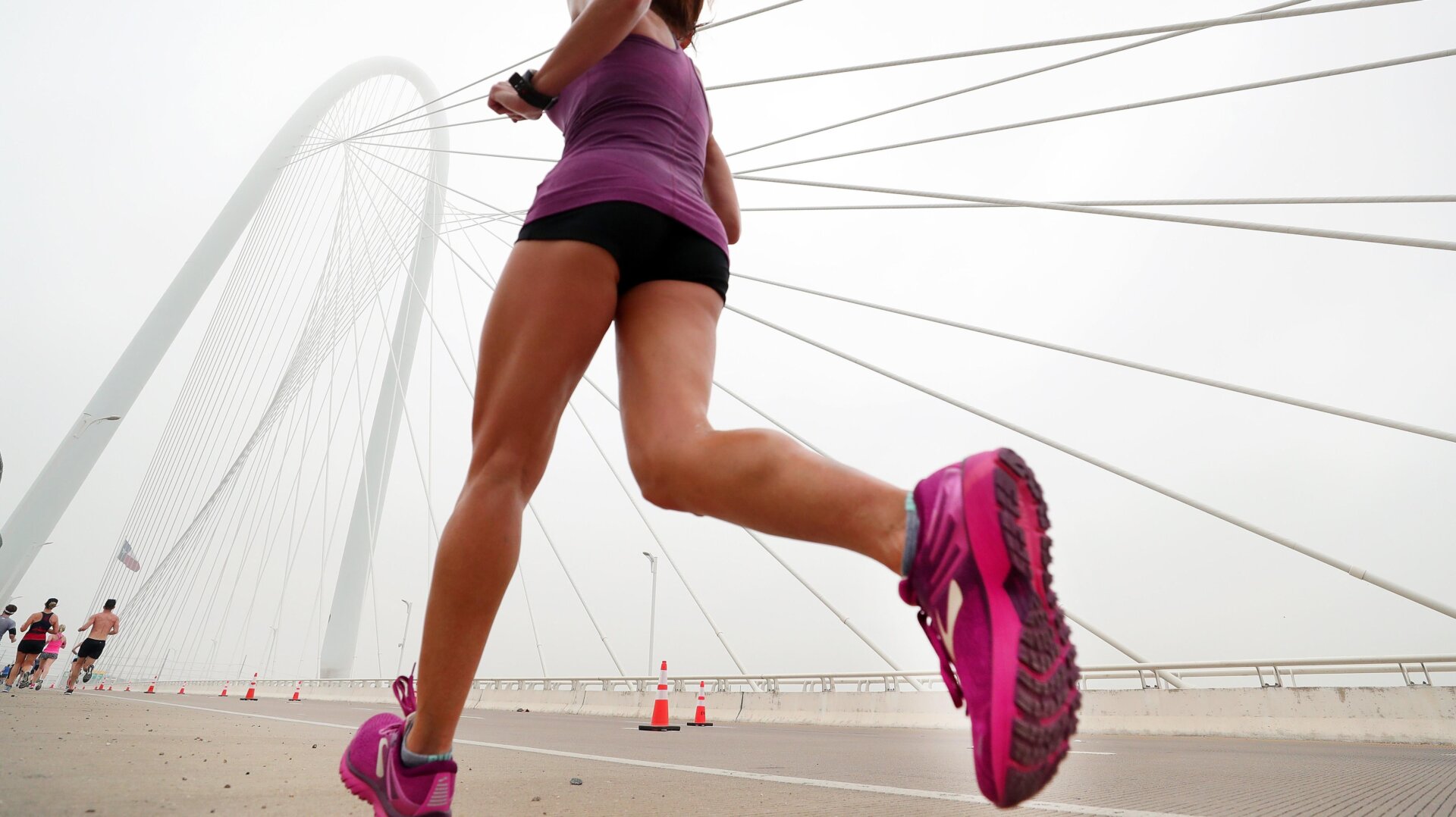 Participants run across the Margaret Hunt Hill Bridge during the Toyota Rock ‘N’ Roll Dallas Half Marathon on March 25, 2018 in Dallas, Texas.