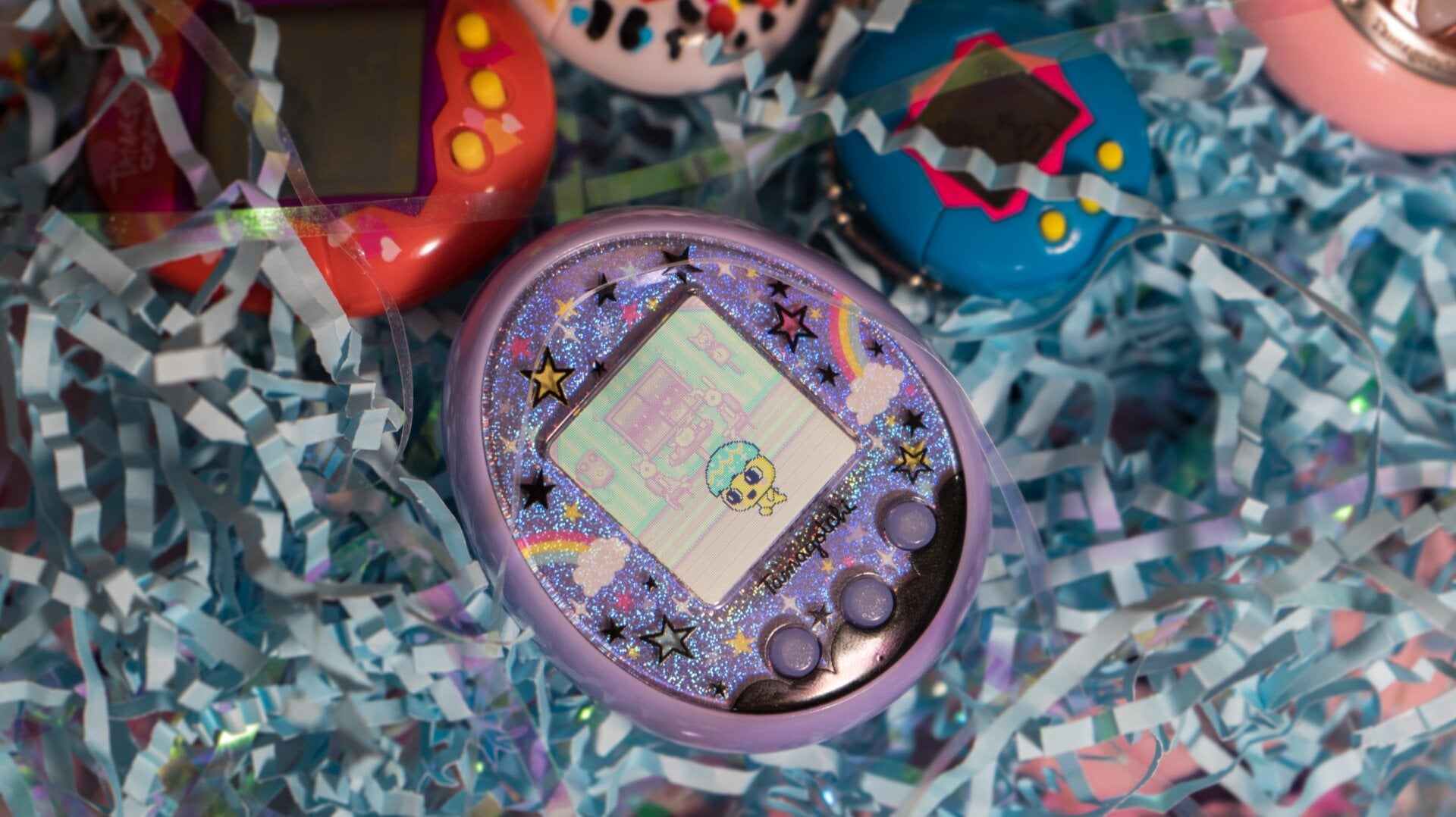 My Tamagotchi On, surrounded by its adopted siblings. 