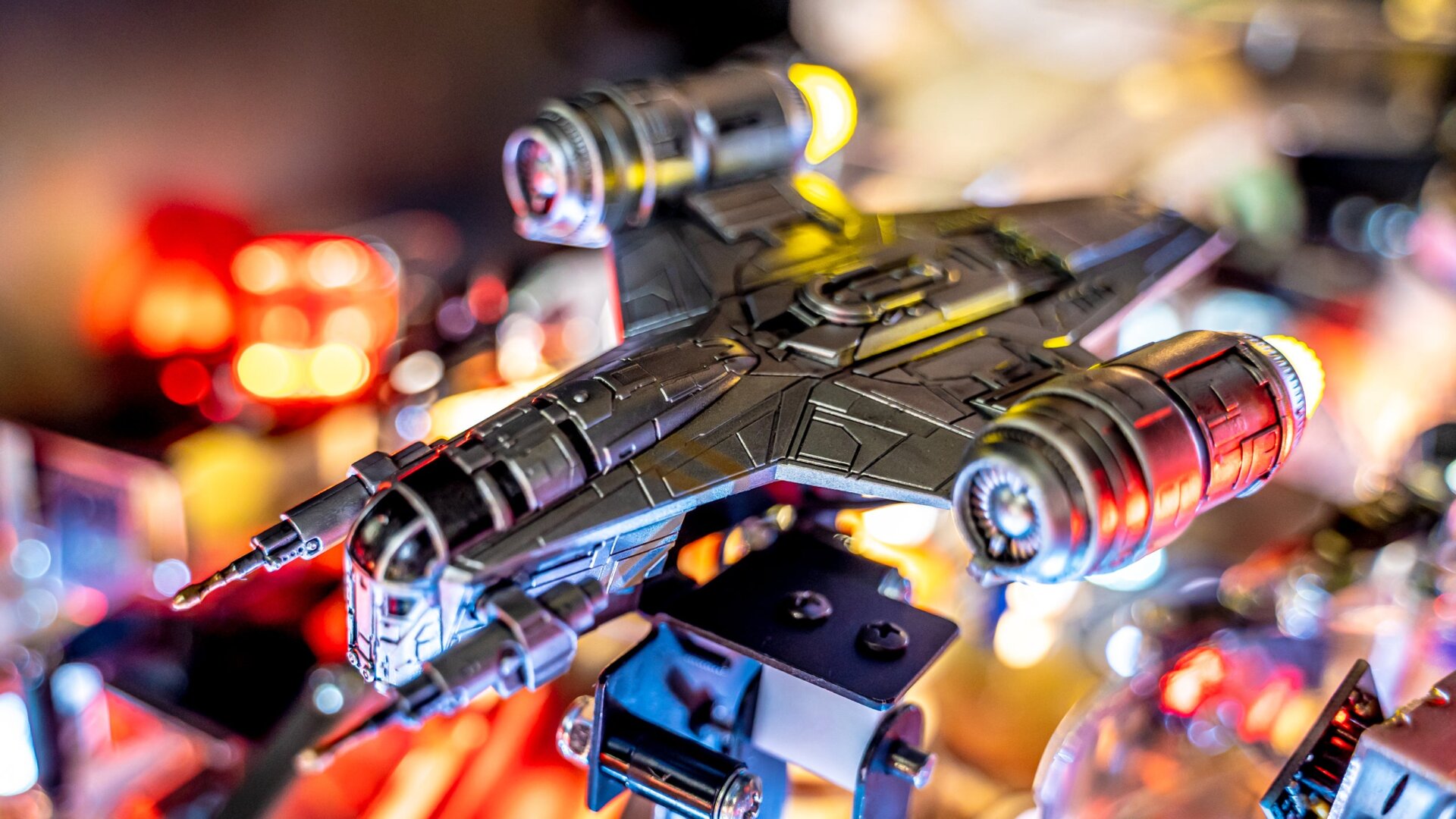 A hanging target beneath a detailed model of the Razor Crest activates a chaotic multi-ball mode.