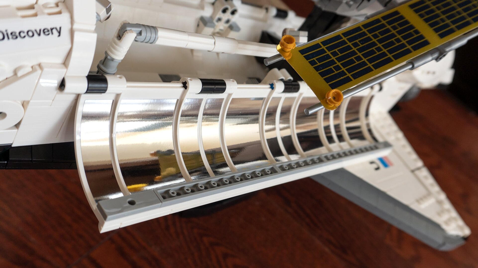 The Space Shuttle Discovery doesn’t use too many stickers, it thankfully comes with lots of pre-printed parts. But you will have to apply all 24 of these reflective decals to the inside of the cargo bay doors by hand, which is as tedious as you can imagine.