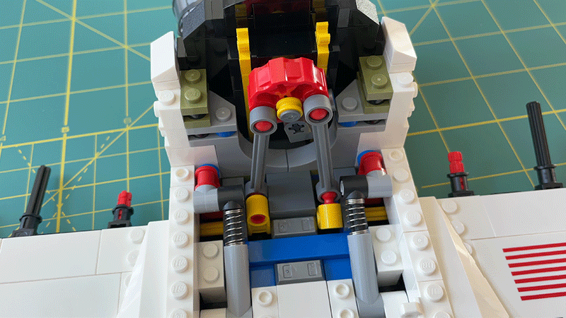 Turning one of Discovery’s engine nozzles causes the orbiter’s elevons to pitch up and down using a clever mechanism inside.