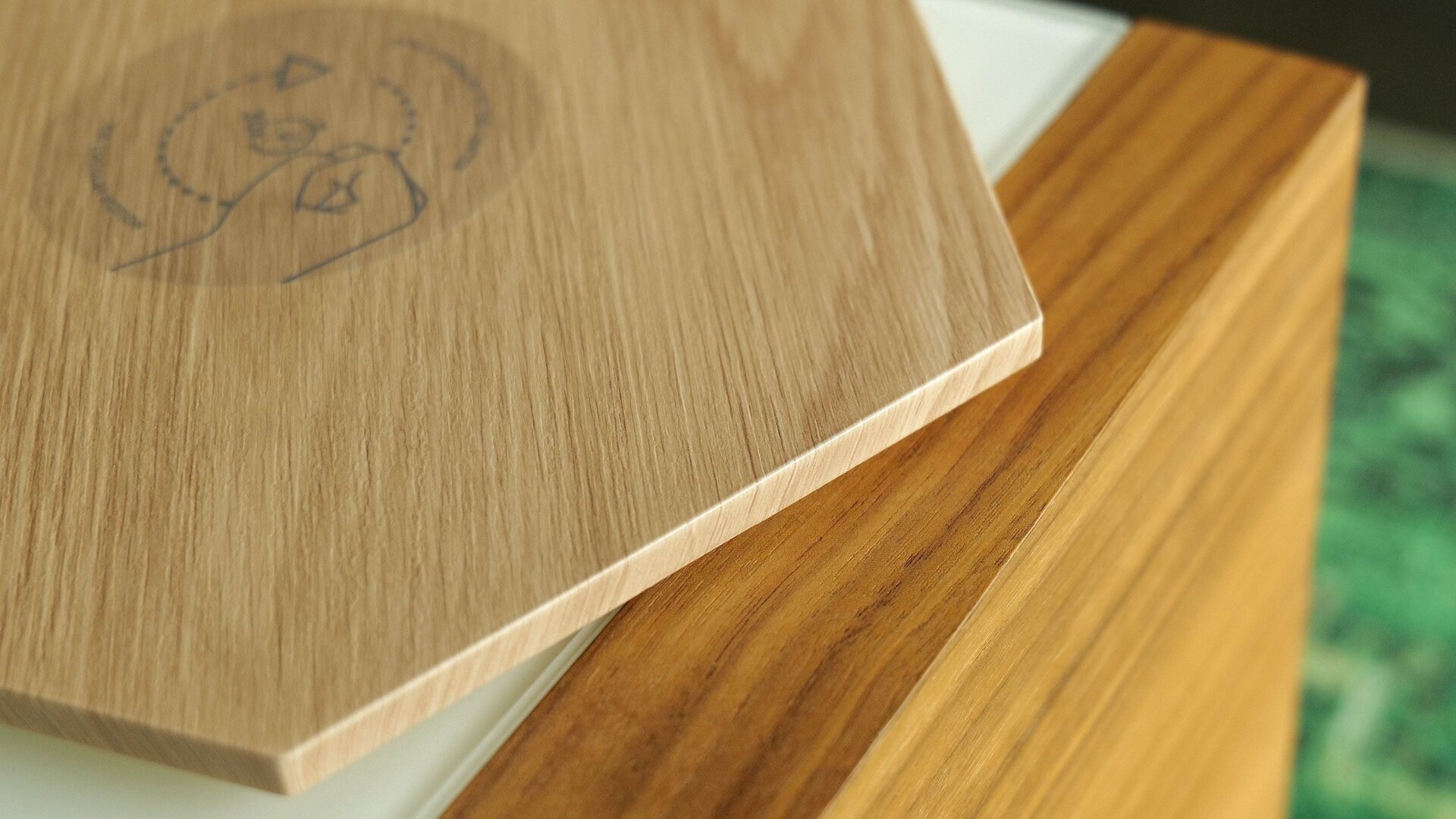 Here’s how the faux wood grain finish on the Elements line compares to actual wood. 