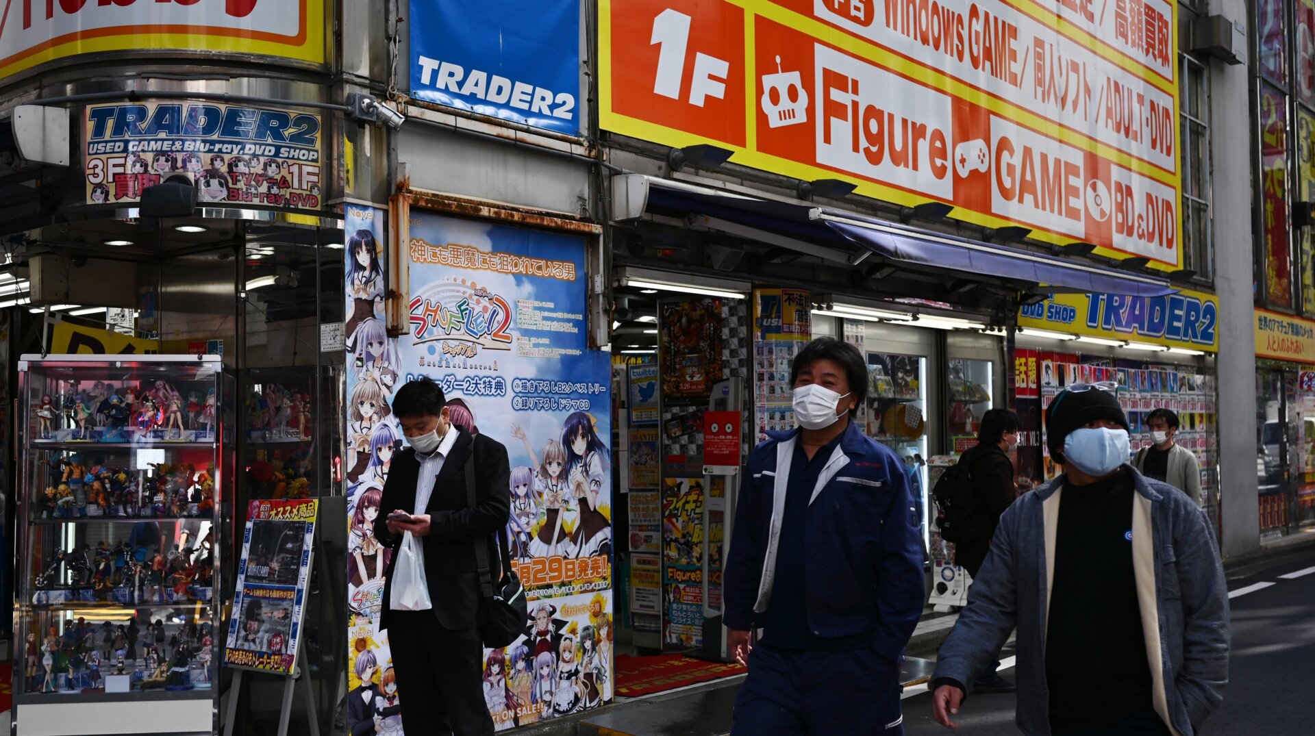 Pedestrians walking in Tokyo’s famous Akihabara district, the epicenter of its retail anime and manga industry, in April 2020. In Japan, illegally downloading movies, music, manga, magazines, or academic publications can result in criminal penalties of up to two years in prison and a two million yen fine.