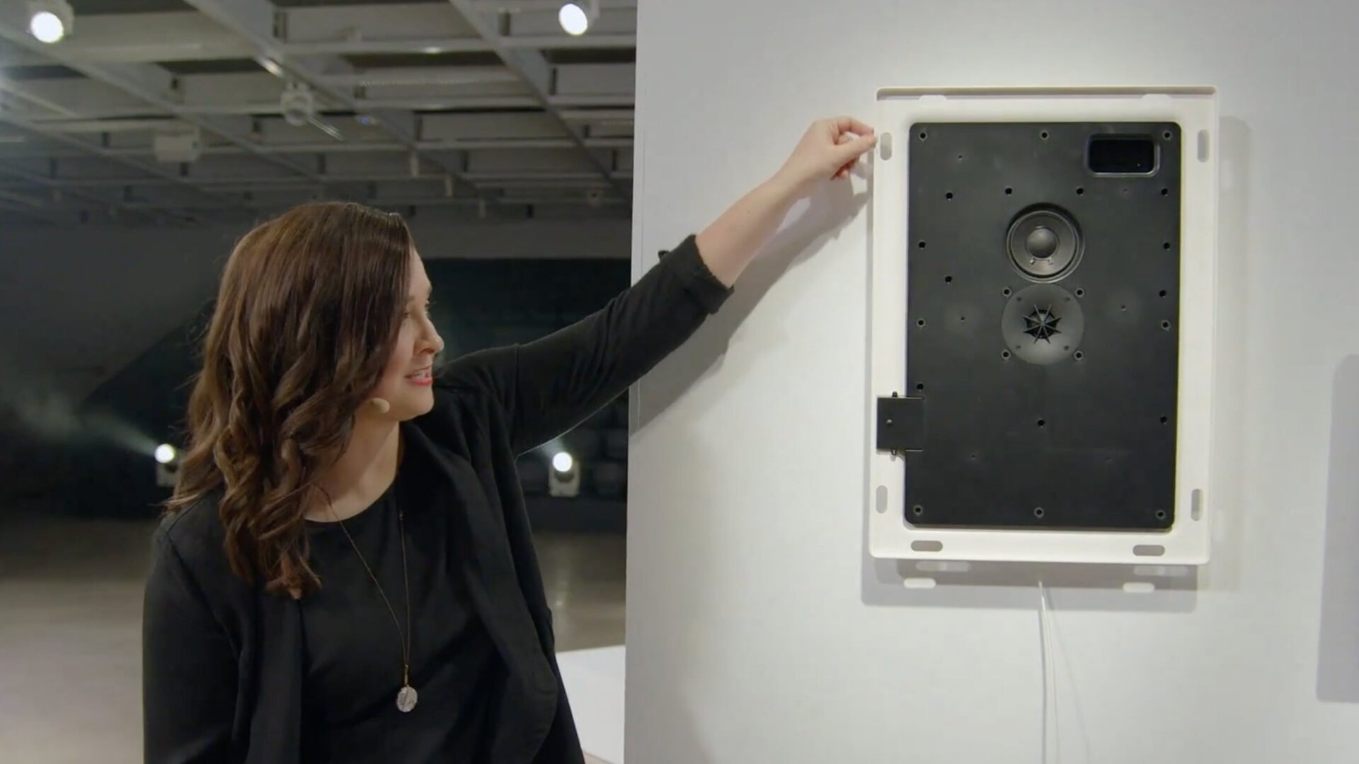 Sonos Principal Product Manager Sara Morris shows the acoustic design of the Symfonisk picture frame speaker.