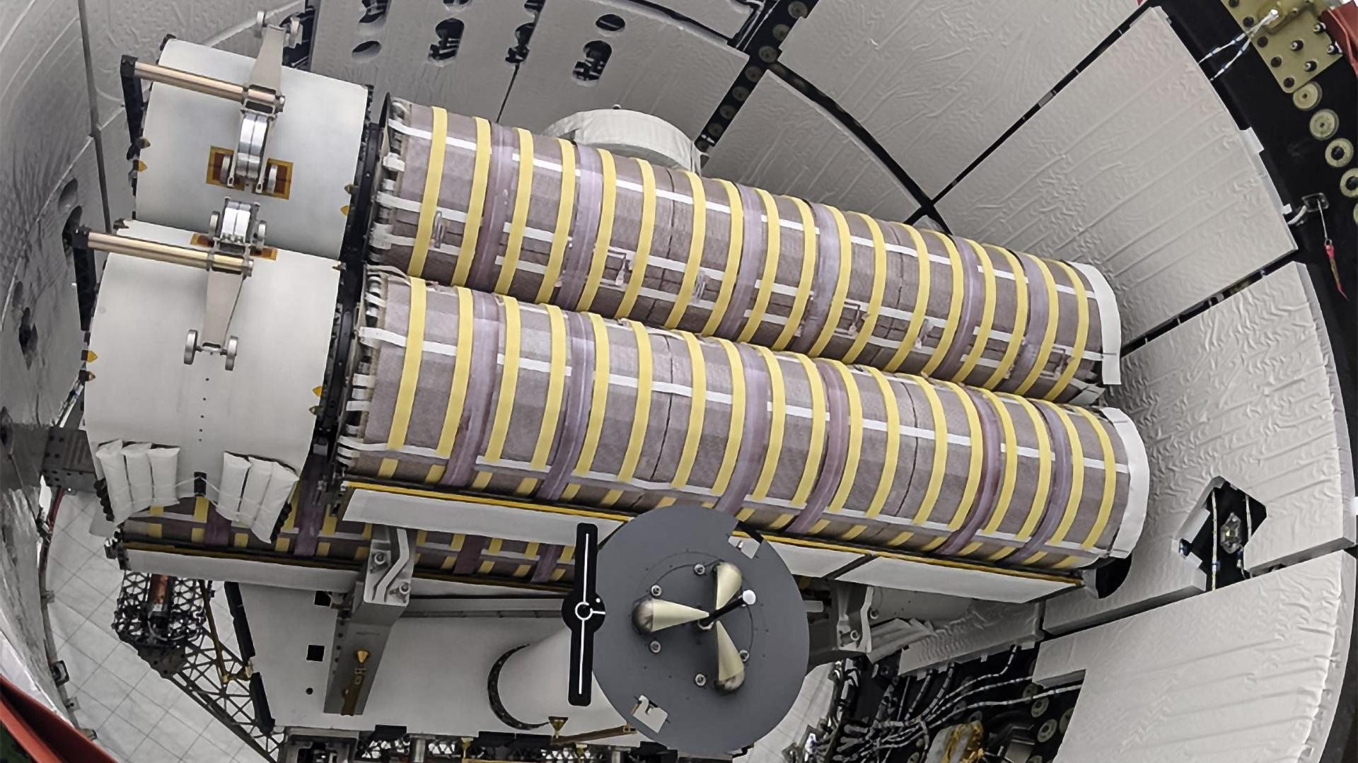 The first two of six new solar arrays for the ISS being loaded into a Dragon spacecraft. 