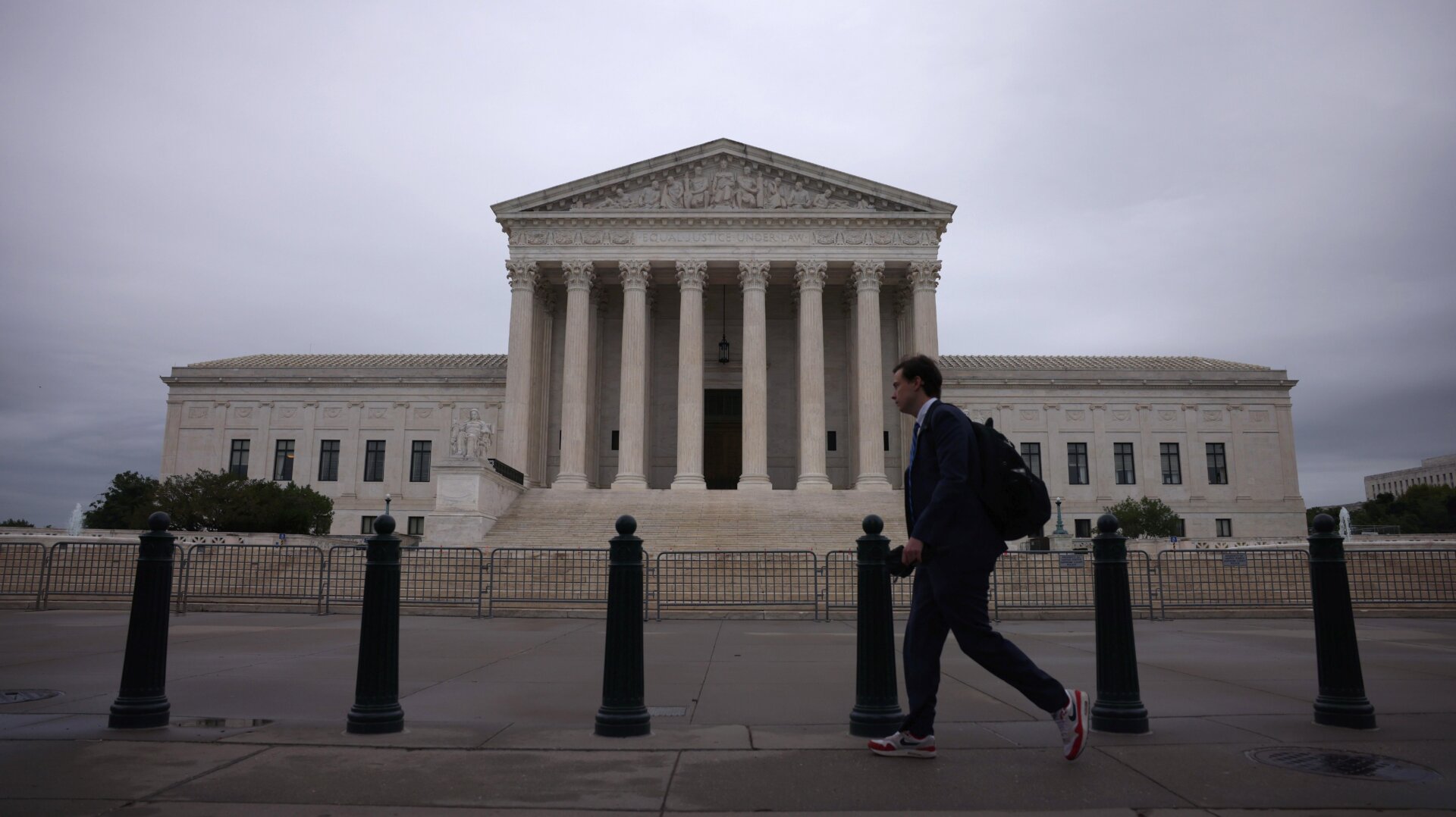 Morning commuters walk by The U.S. Supreme Court building May 24, 2021 in Washington, DC.