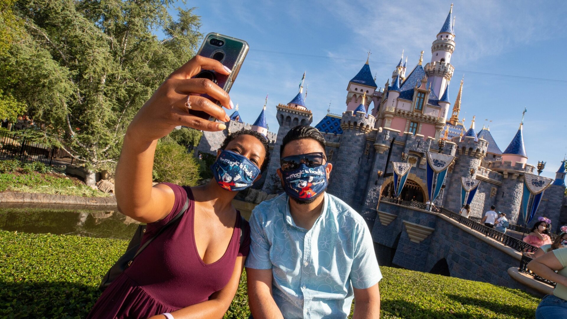 Guests at Disneyland on its reopening day, April 30. Masks will no longer be required starting June 15.