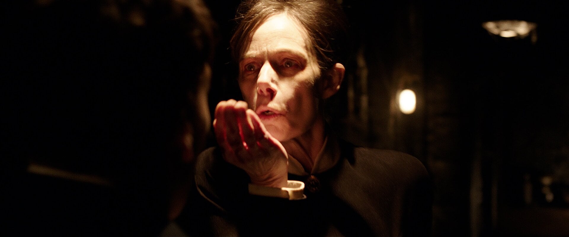 The Occultist (Eugenie Bondurant) doing something as spooky as you’d expect, going by that character name, in The Conjuring: The Devil Made Me Do It.