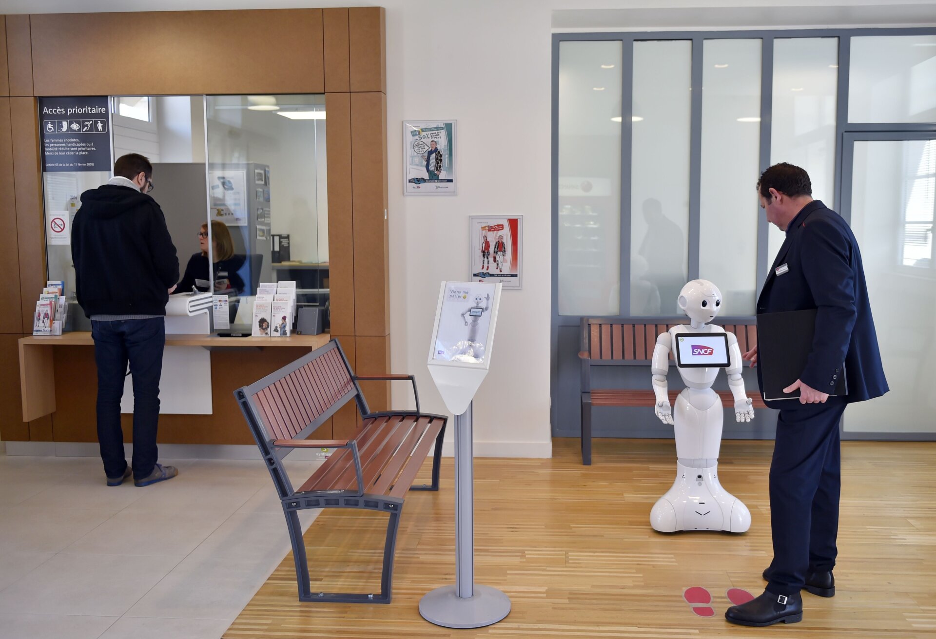 Pepper delivers information to passengers of the French railway company SNCF on March 2, 2016 at the Nort-sur-Erdre train station, one of three stations Pepper appeared in the Pays de la Loire region of France.
