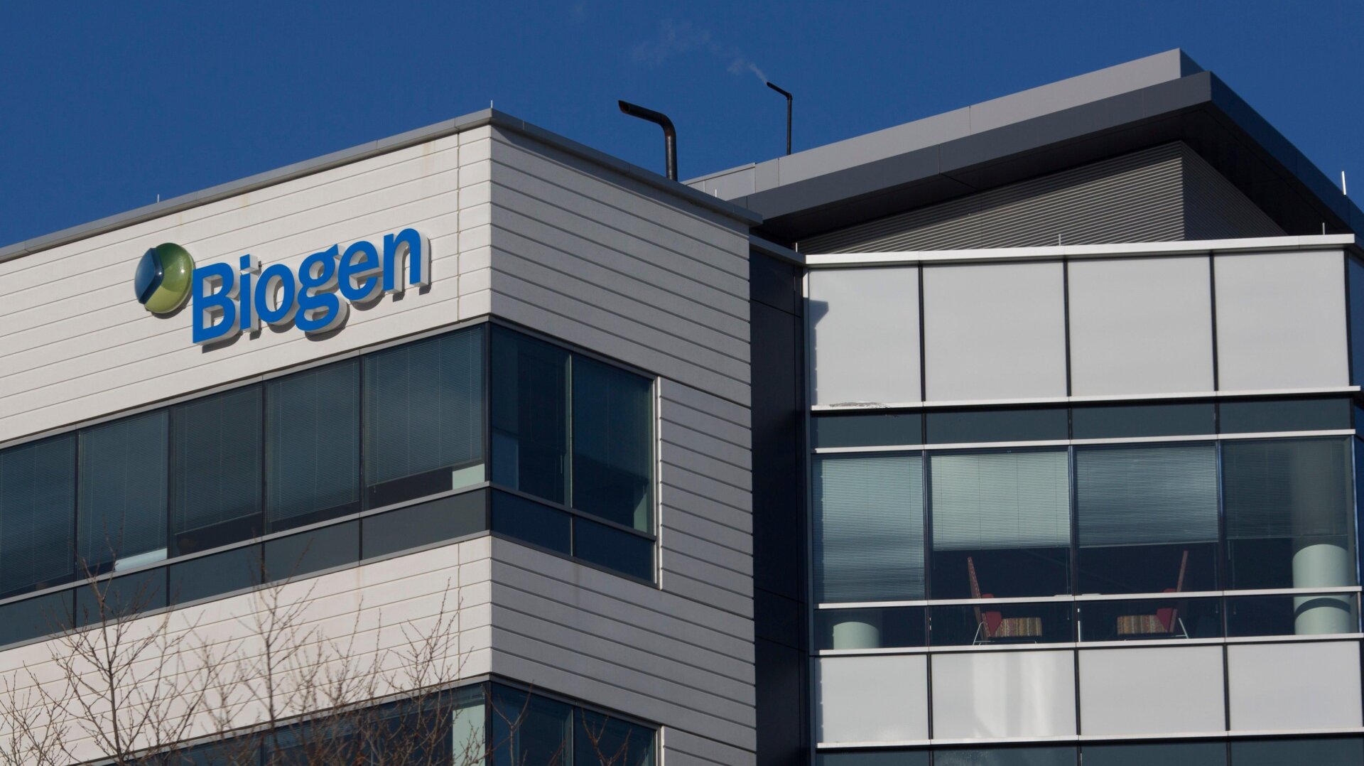 A sign for biotechnology company, Biogen, Inc. is seen on a building in Cambridge, Massachusetts, on March 18, 2017