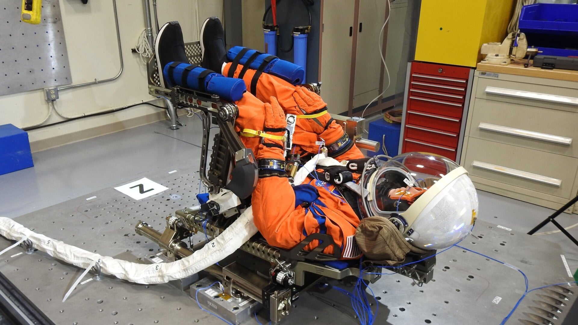 The manikin strapped in its Orion chair and in launch position.