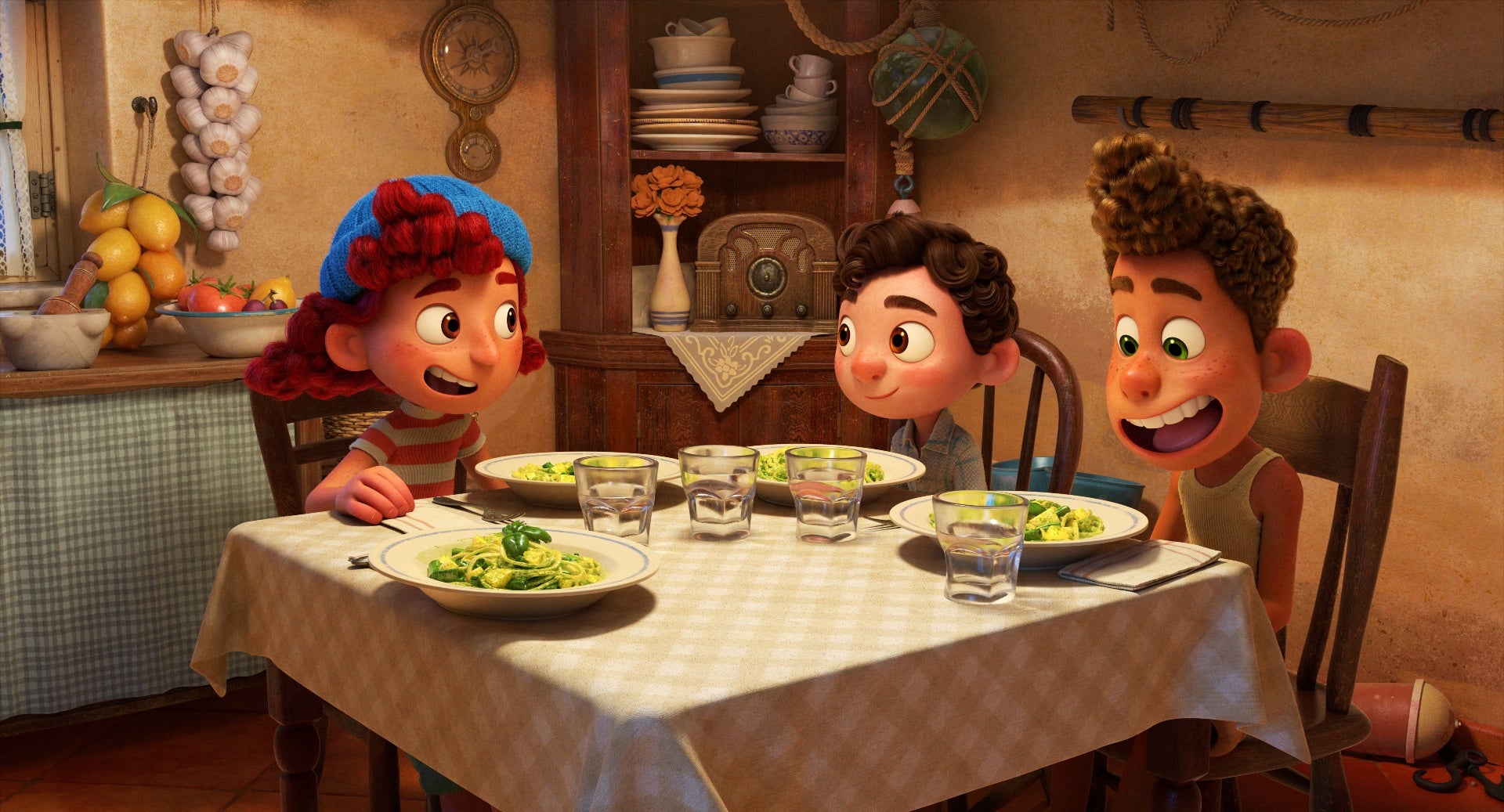 Giulia, Luca, and Alberto enjoy some pasta.