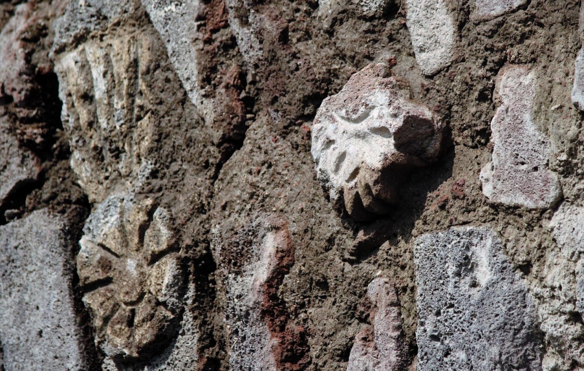 Several of the pre-Hispanic artworks adorning the flood-control tunnel wall.
