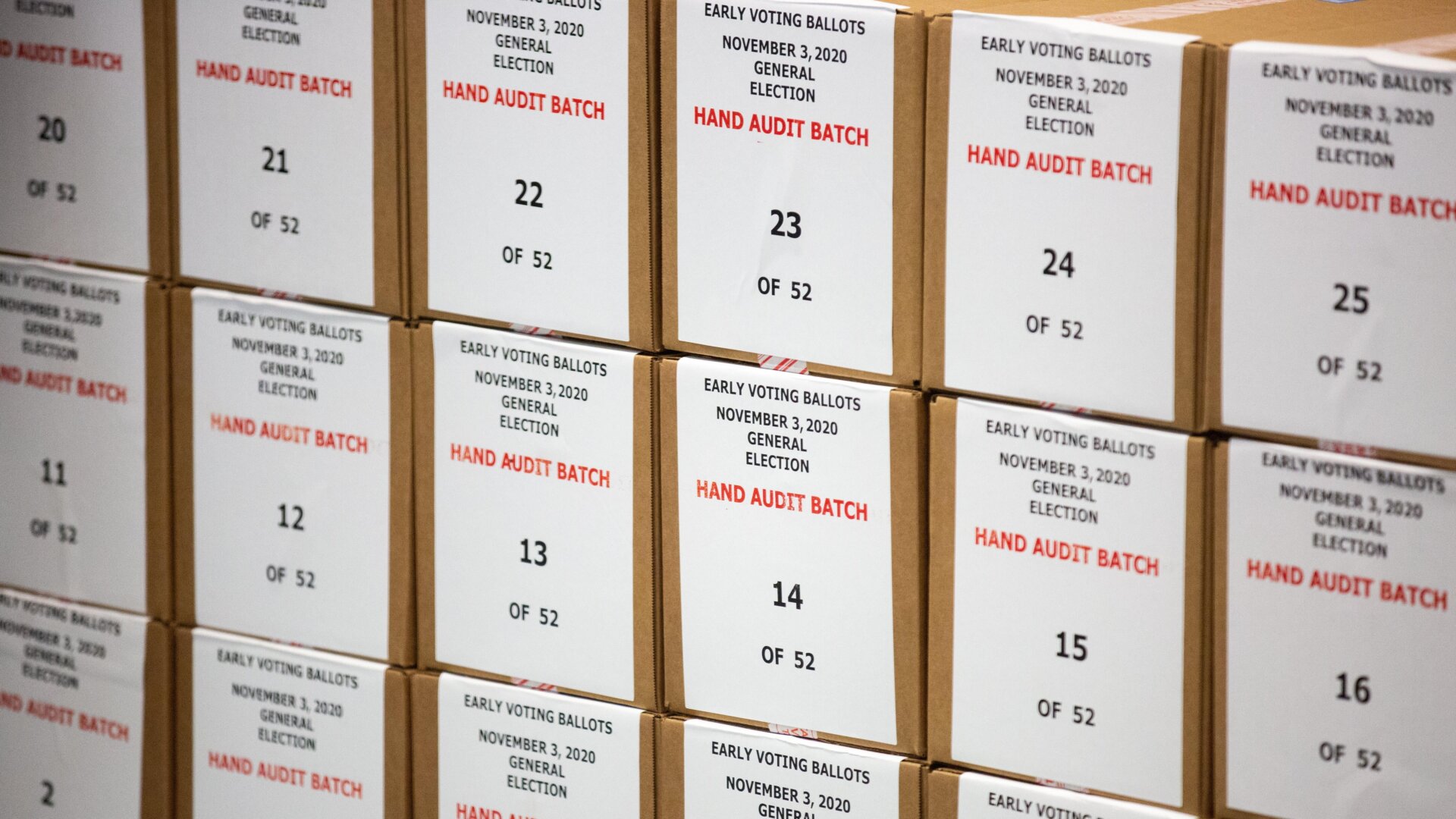 Early voting ballots piled up for legitimate hand auditing by Maricopa County Elections Department staff in October 2020 in Phoenix, Arizona.