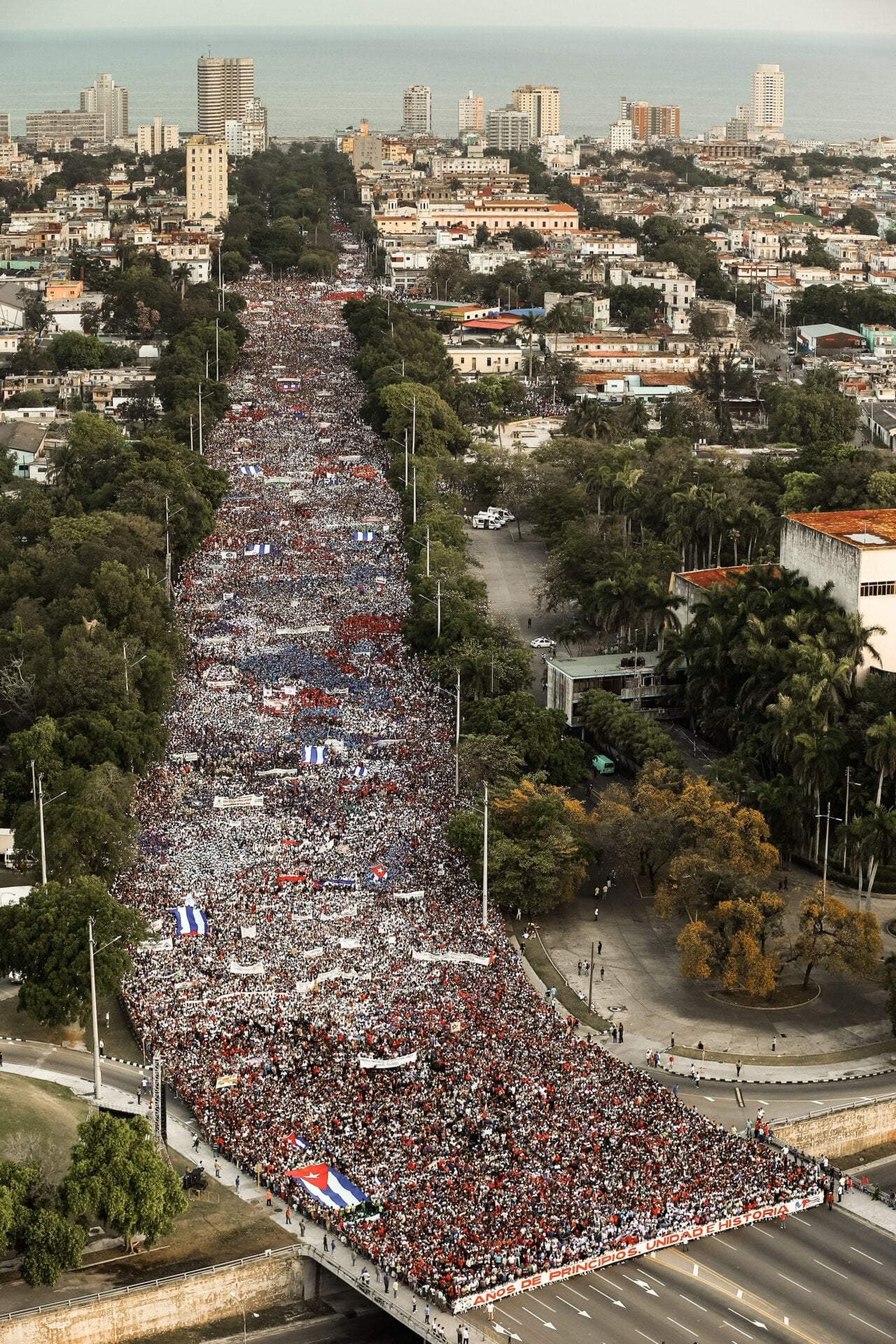 People march to Revolution Square in Havana to celebrate May Day, on May 1, 2018
